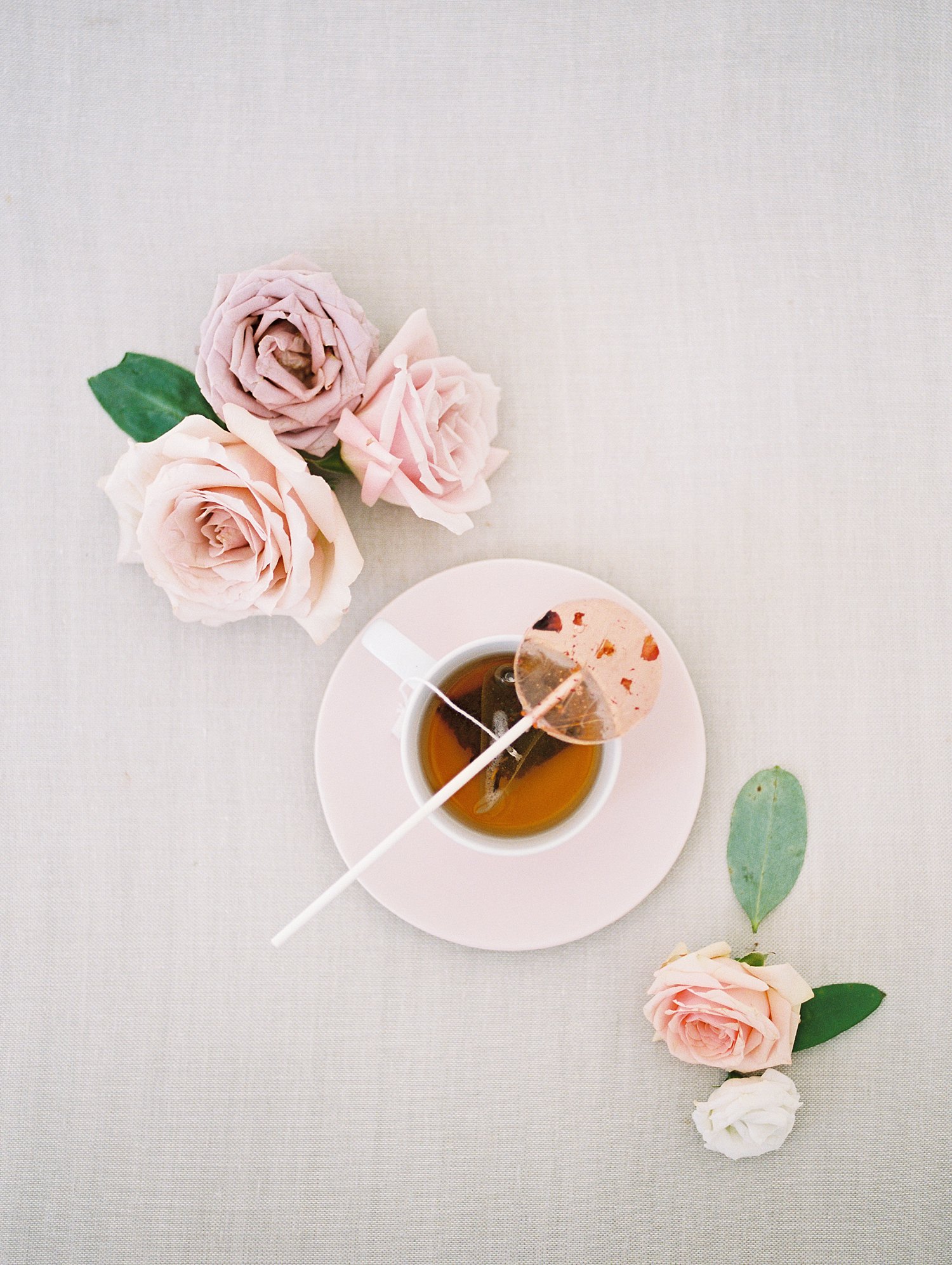 hot tea styled with a floral lollipop