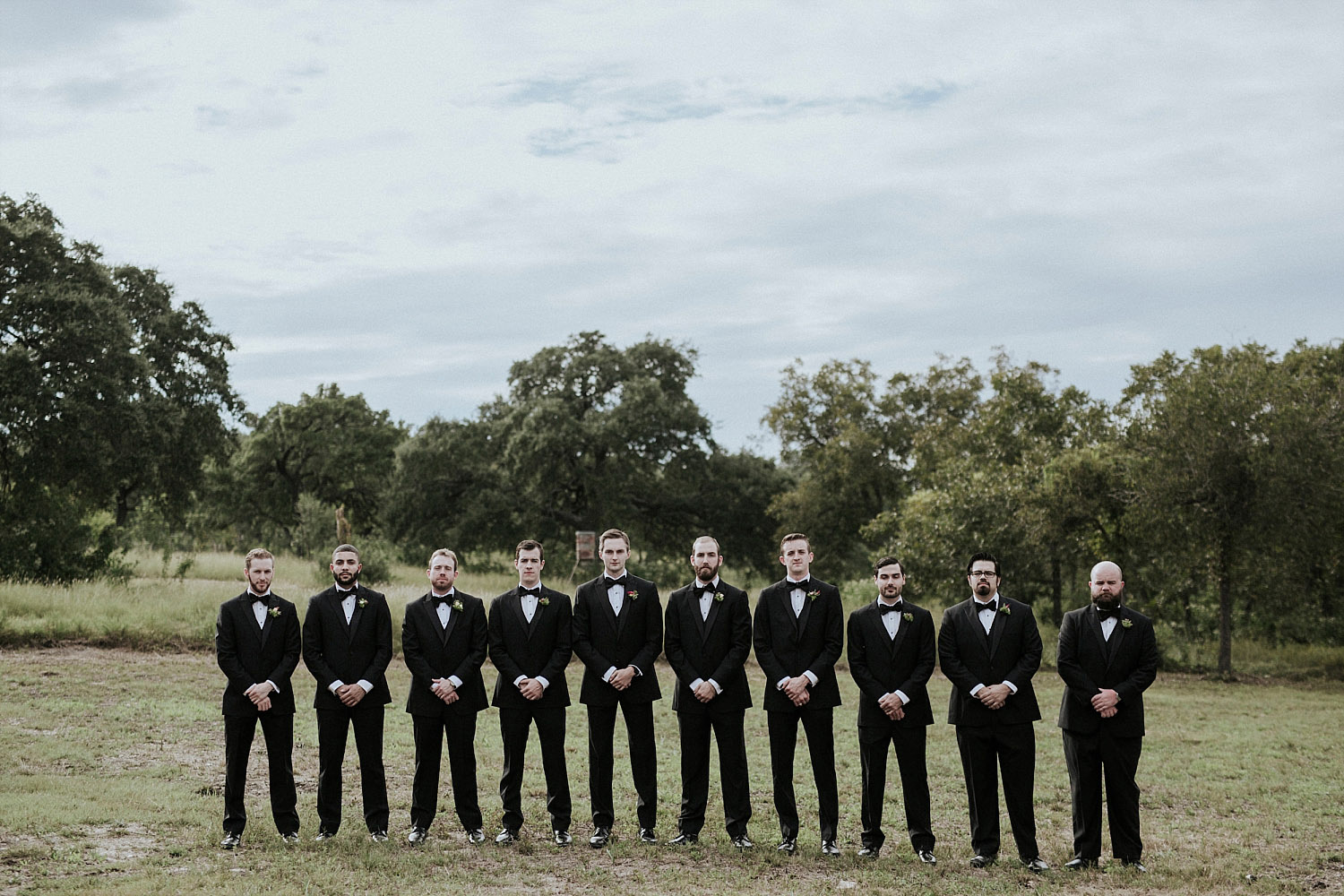 groomsmen in austin wearing black tuxes