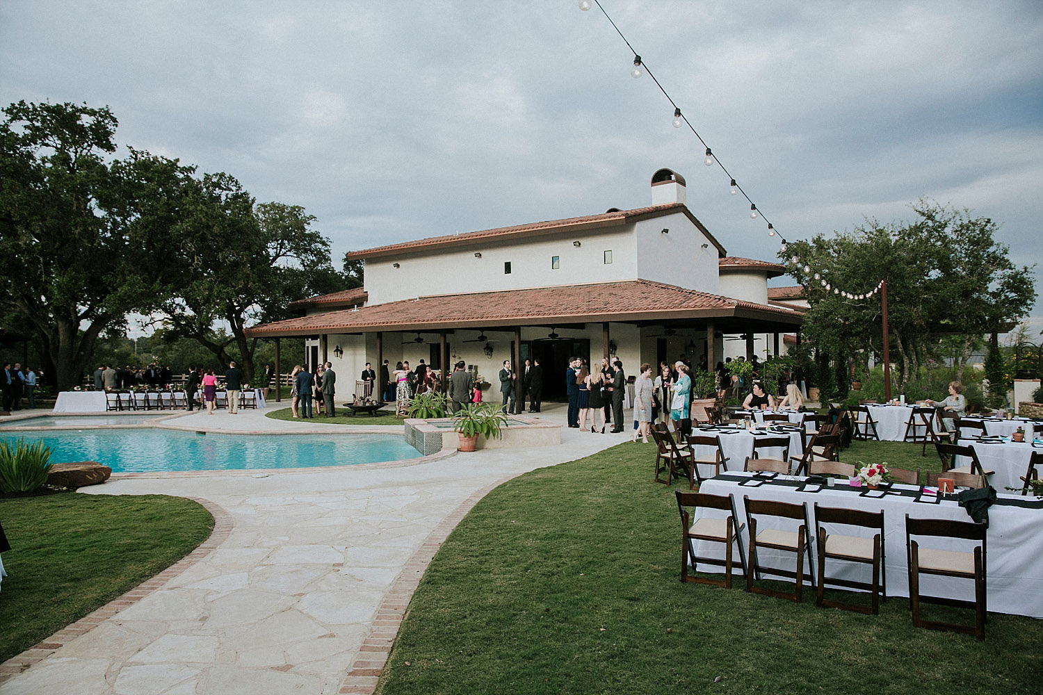 Outdoor reception in austin texas around a pool