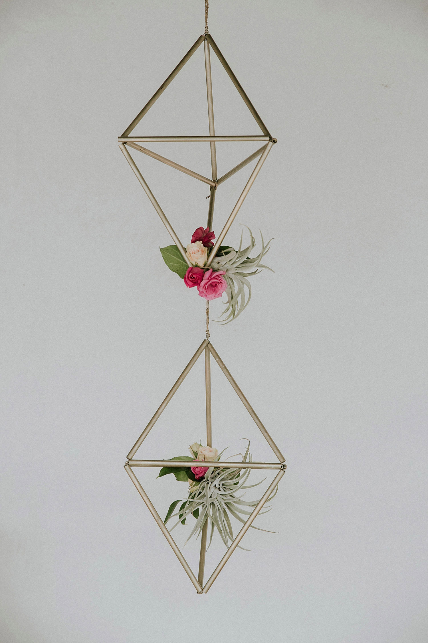 hanging geometric shapes with flowers
