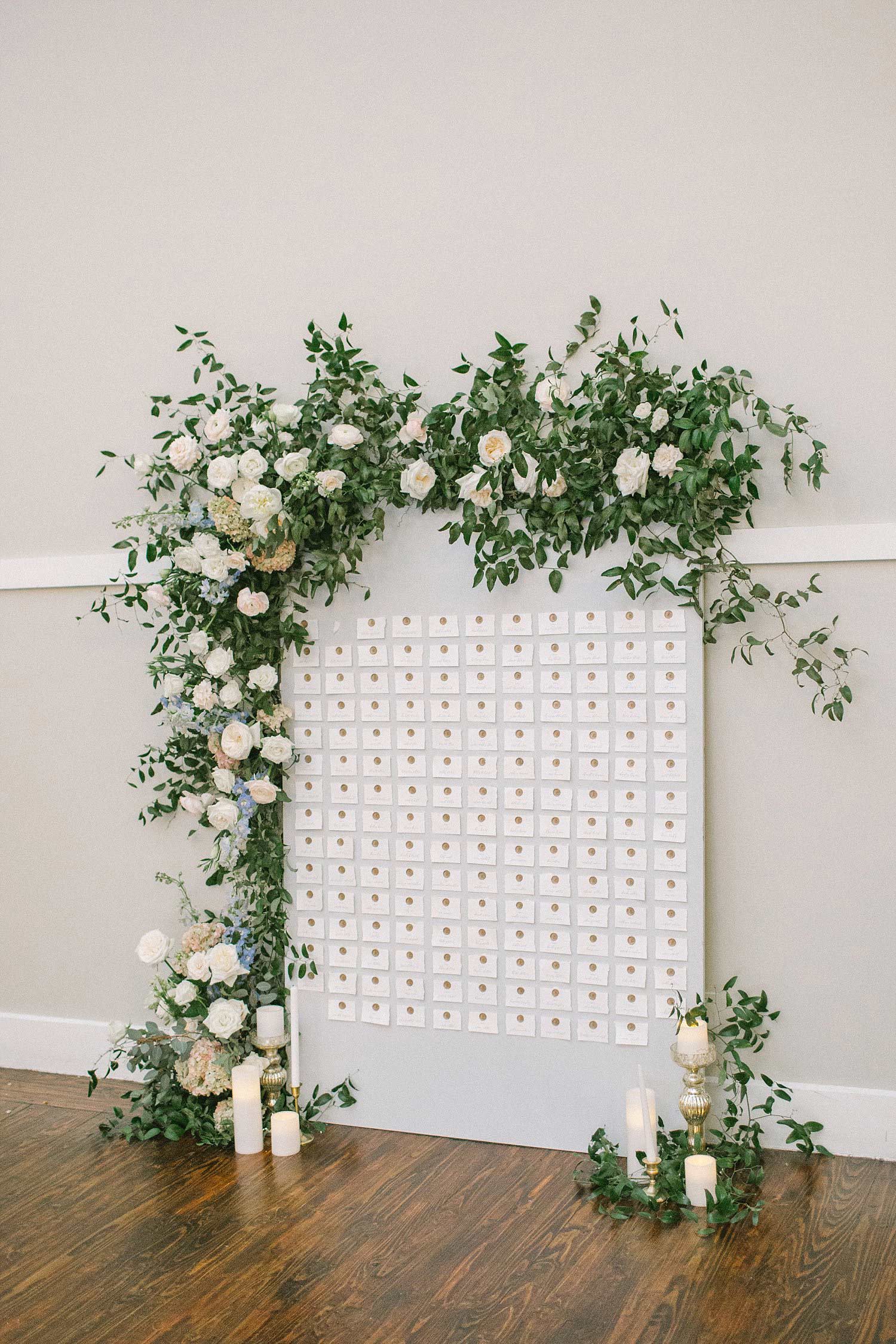 Grey wax seal seating chart with organic flowers