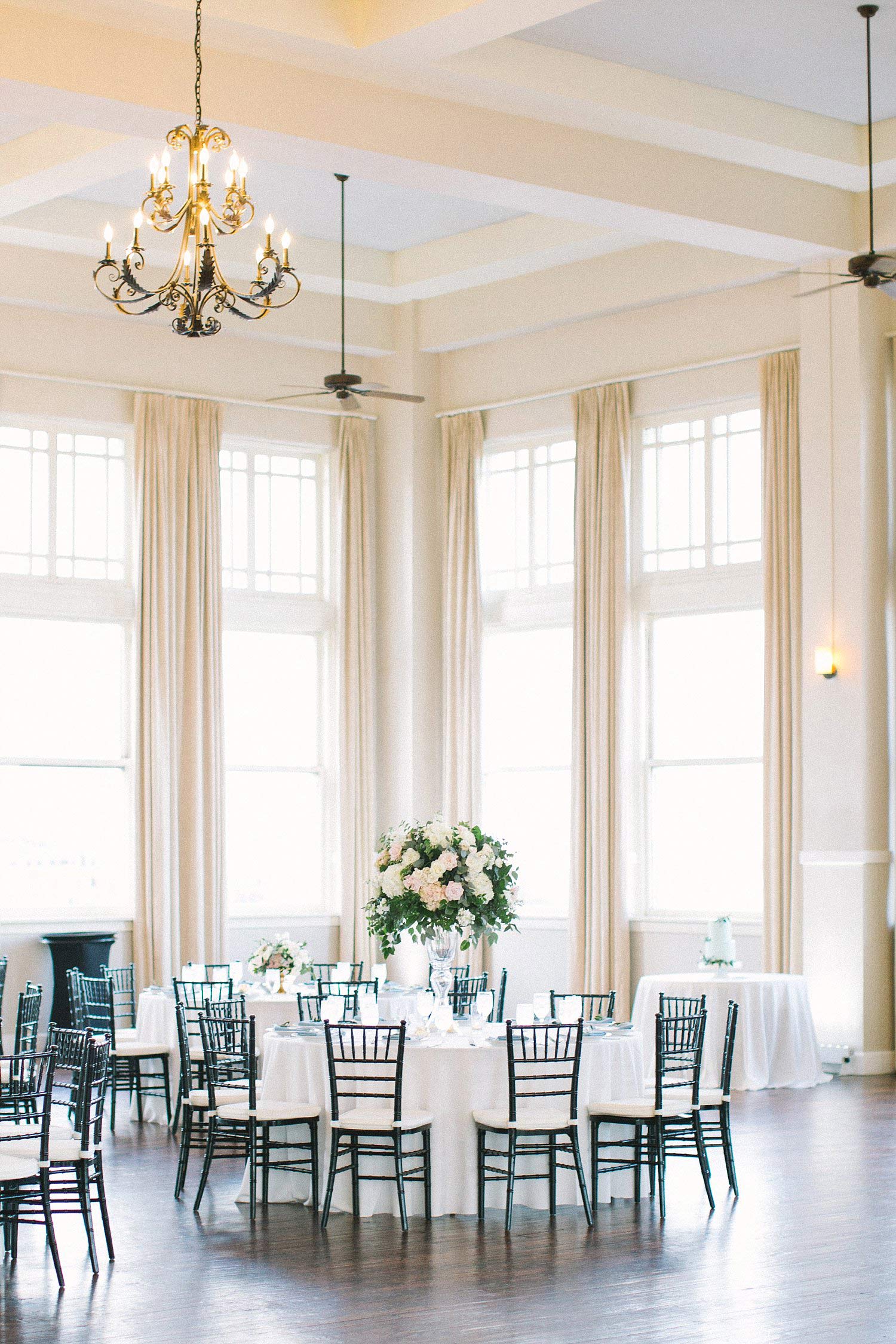 Room on Main reception with tall centerpieces