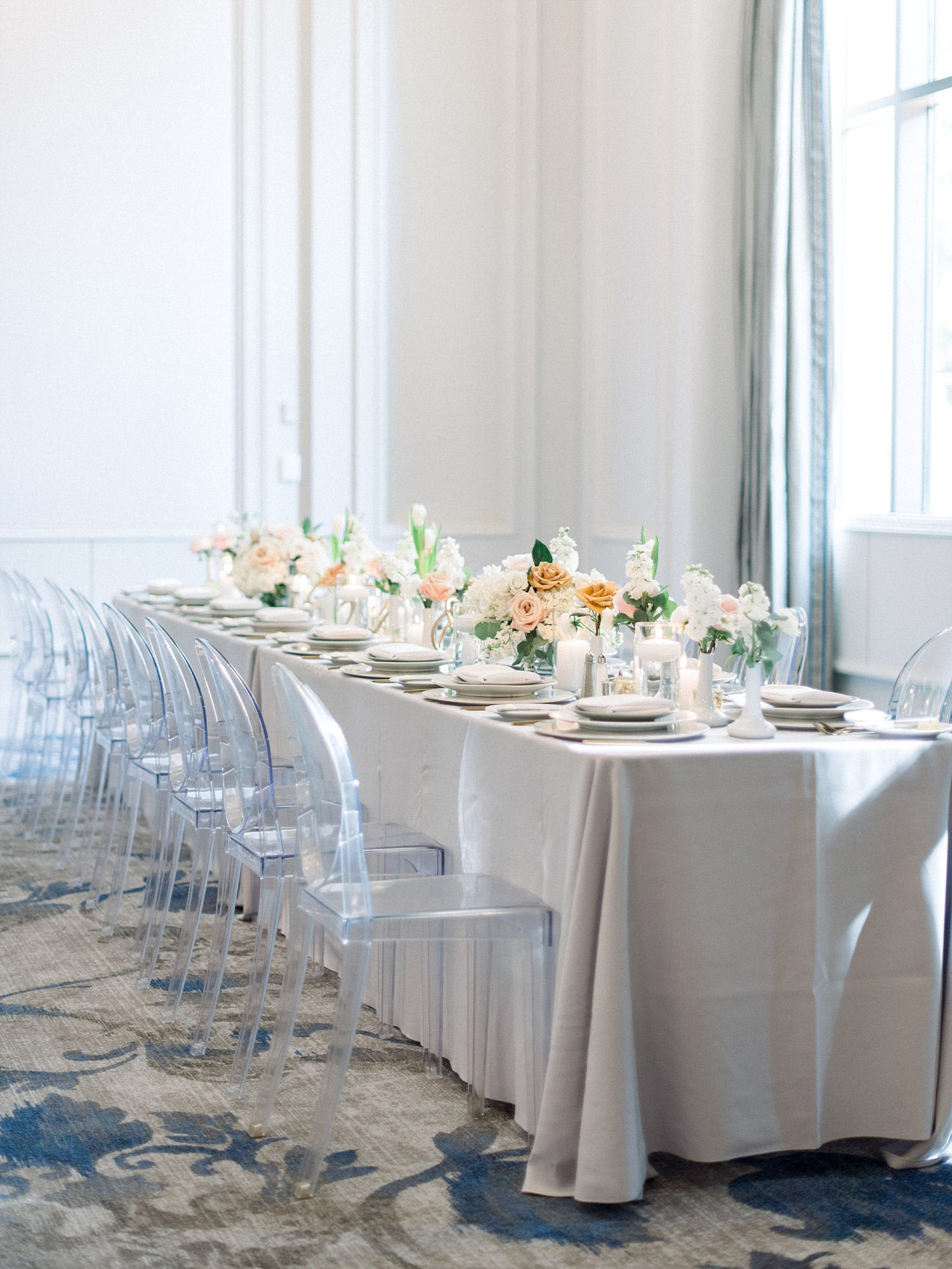 Ballroom wedding with Acrylic Chairs with a light grey linen