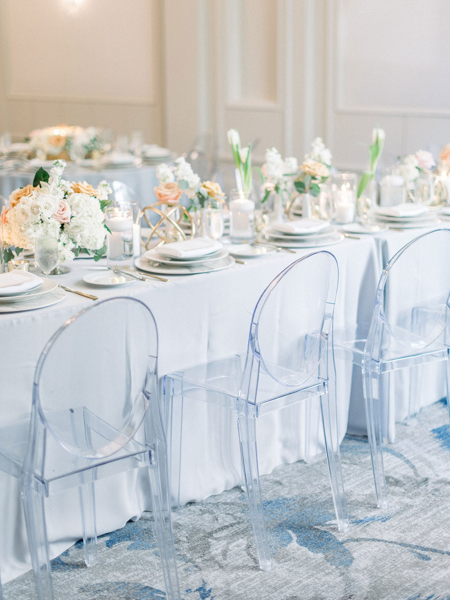 Grey linen and acrylic chair tablescape