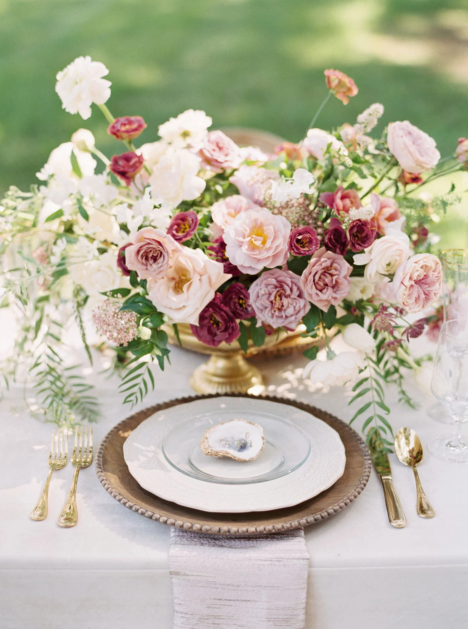 Southern Place setting with a wood charger and mauve flowers
