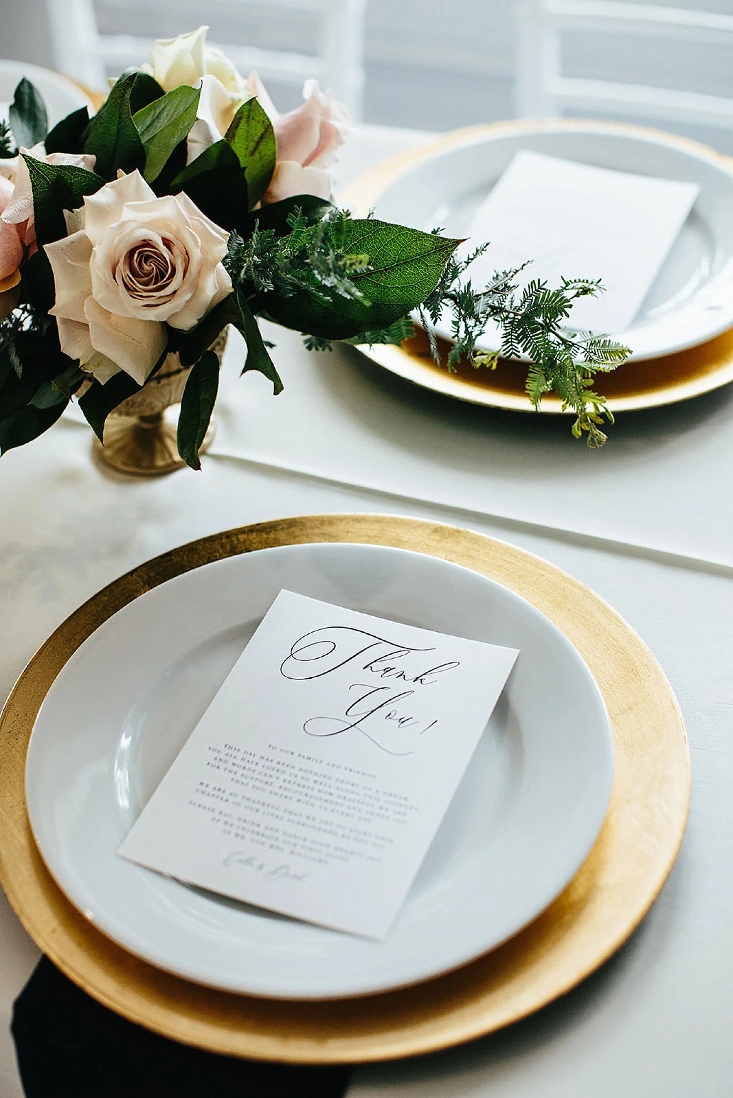 Gold Charger with white menu and navy napkin