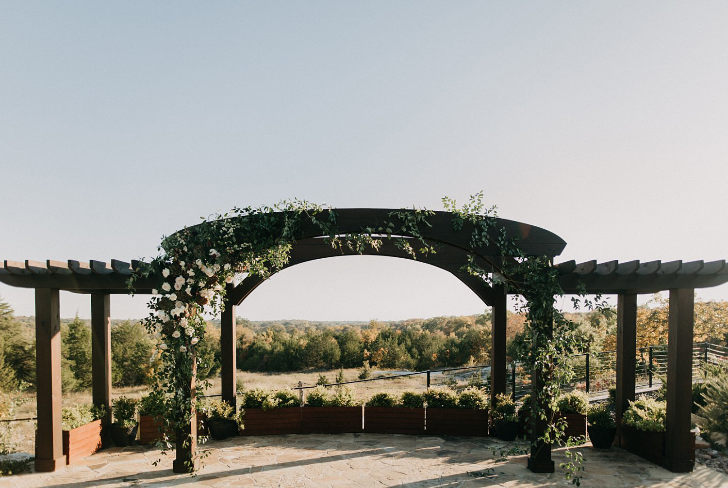 Large out door Wooden pavilion with organic white &amp; black flowers