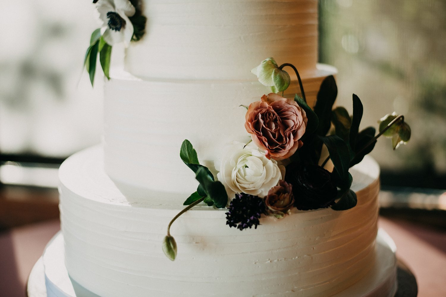 Wedding cake with dusty rose, white &amp; pink whimsical flowers