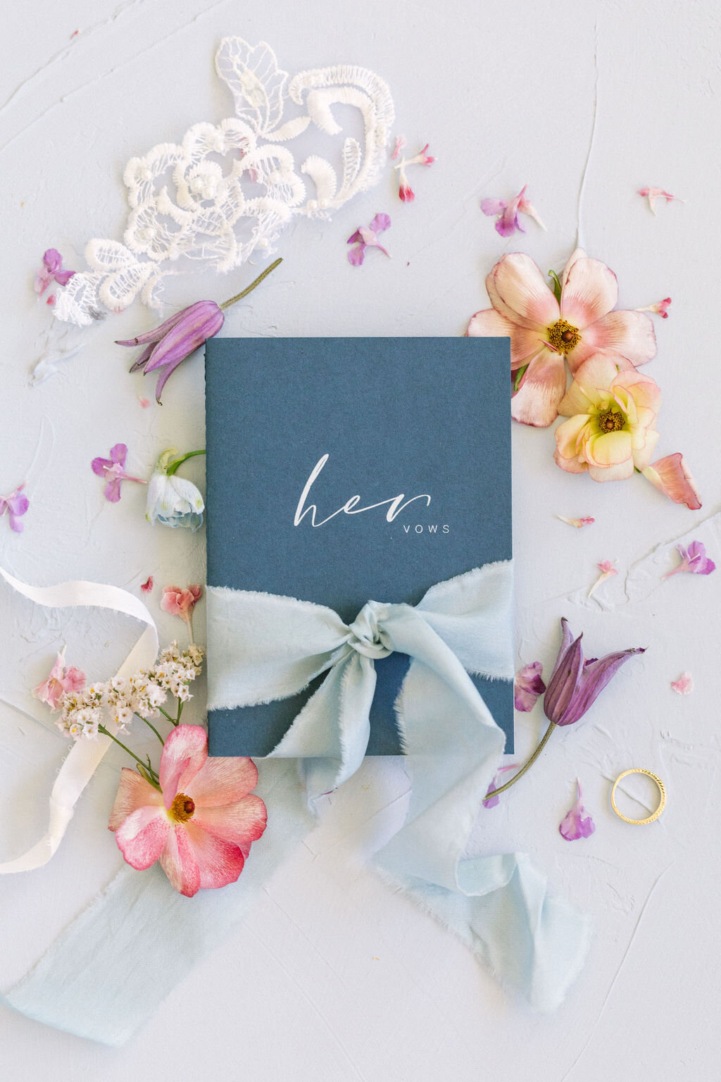 Navy Blue vow book with light blue ribbon &amp; pink flowers