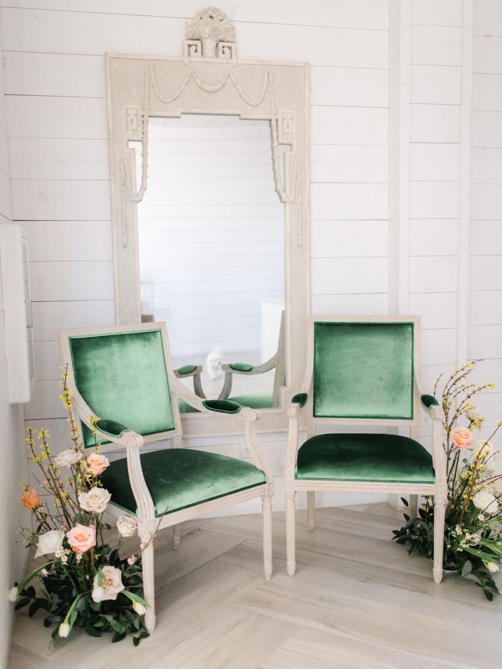 Velvet green chair lounge at indoor barn wedding