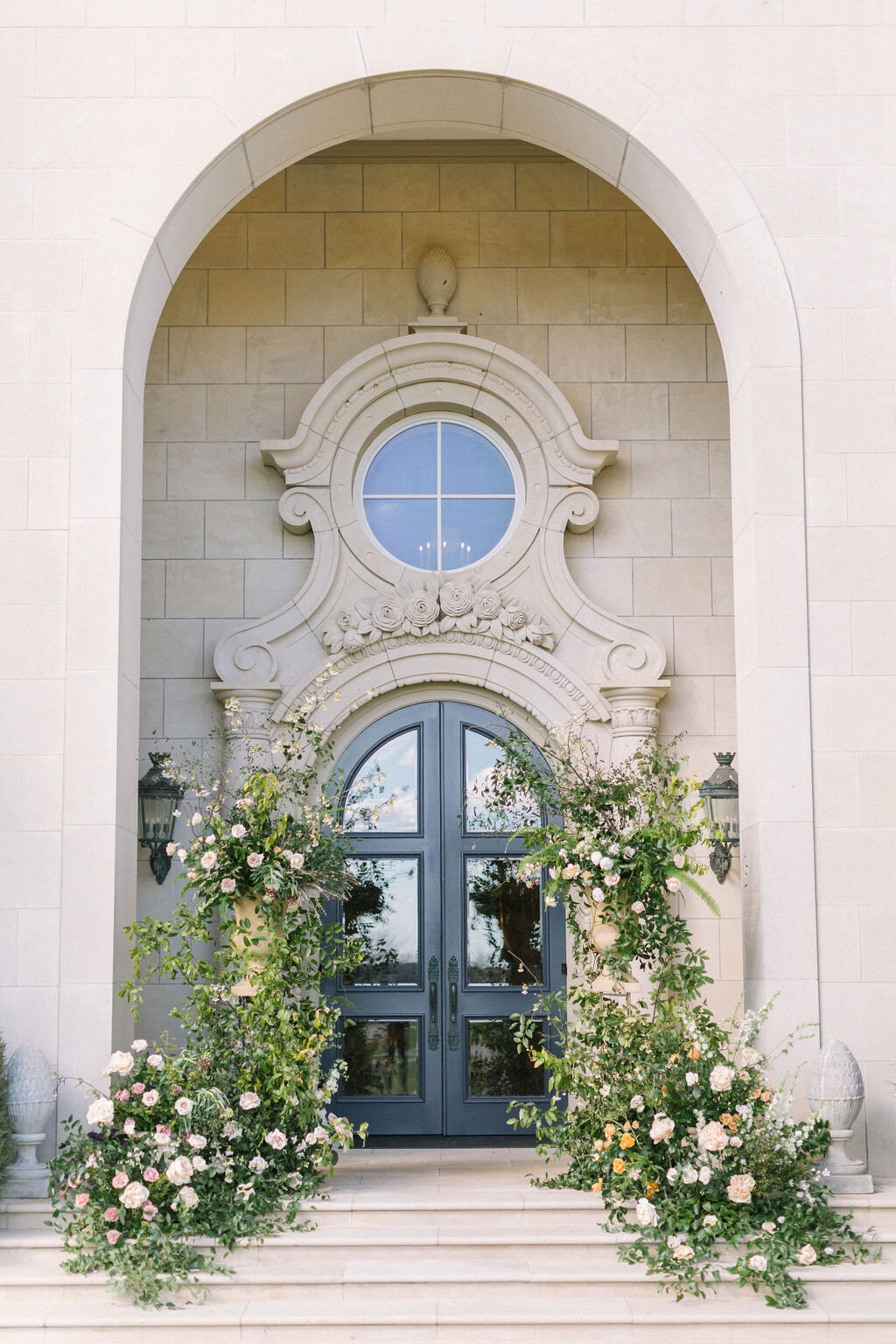Organic archway on the steps for a outdoor wedding ceremony