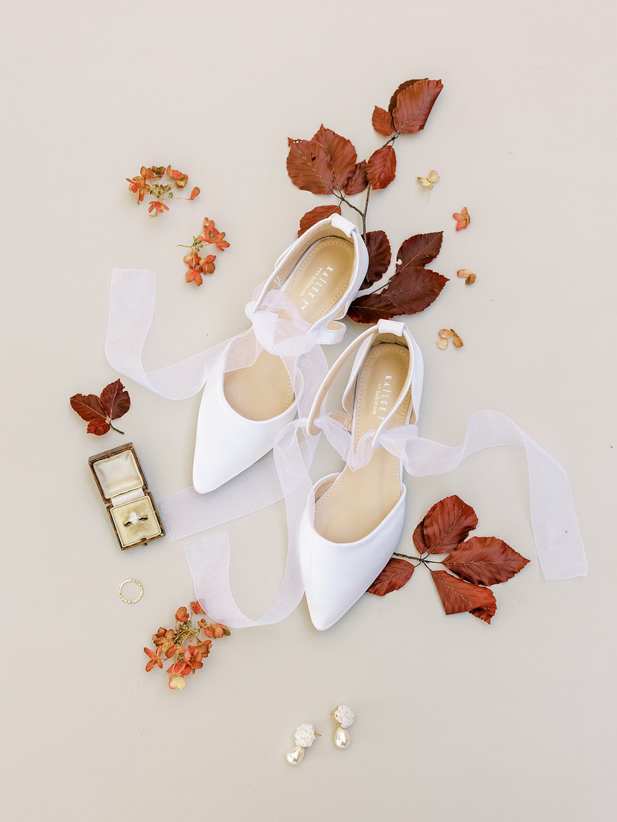 White wedding shoes with red leaves