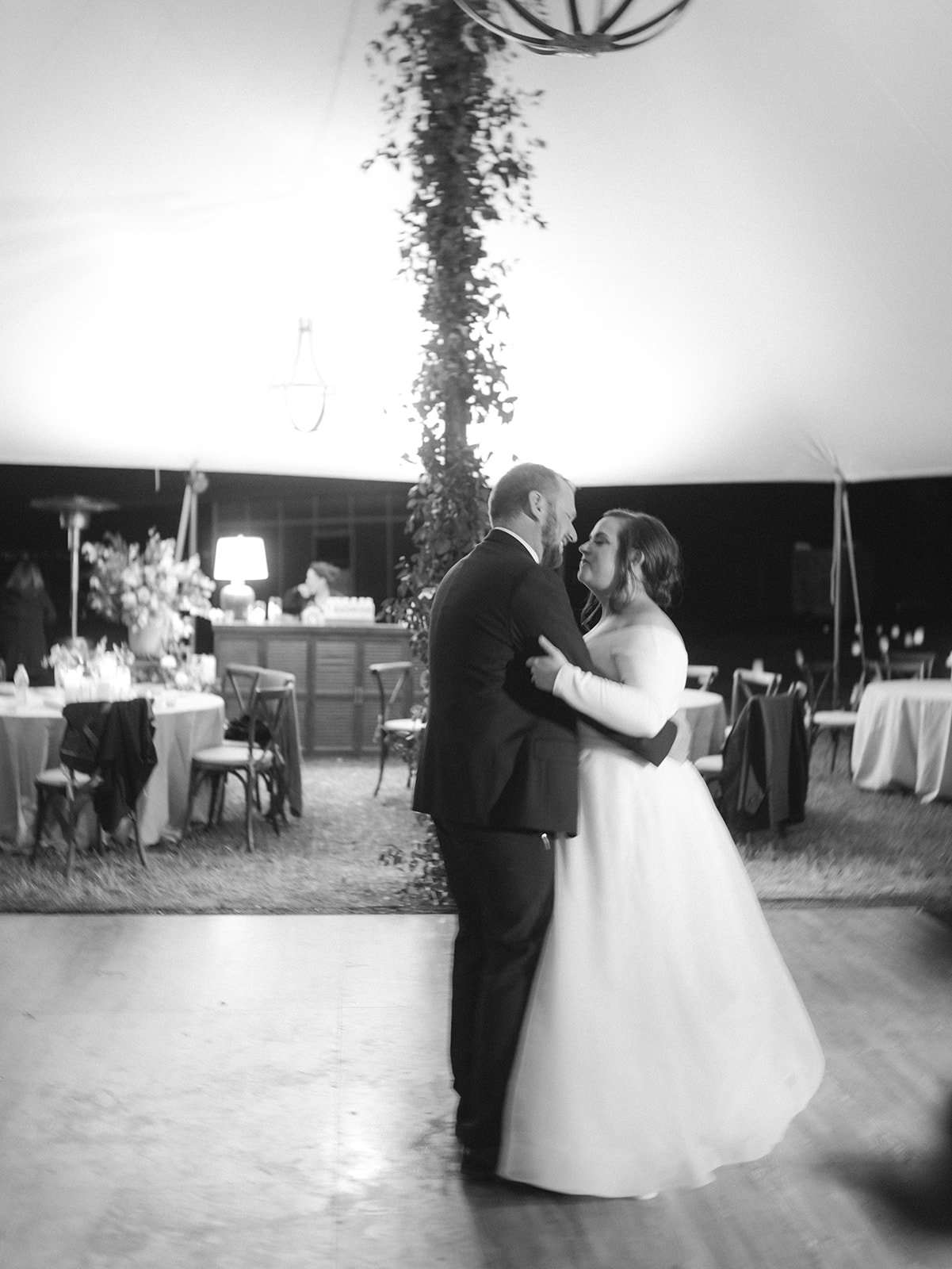 Bride and groom dancing in sailcloth tent at Texas wedding