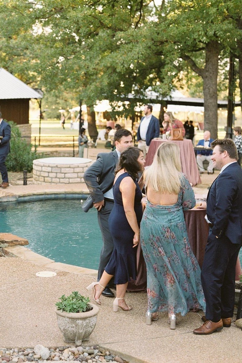 Country wedding cocktail hour by pool at private estate wedding in Texas