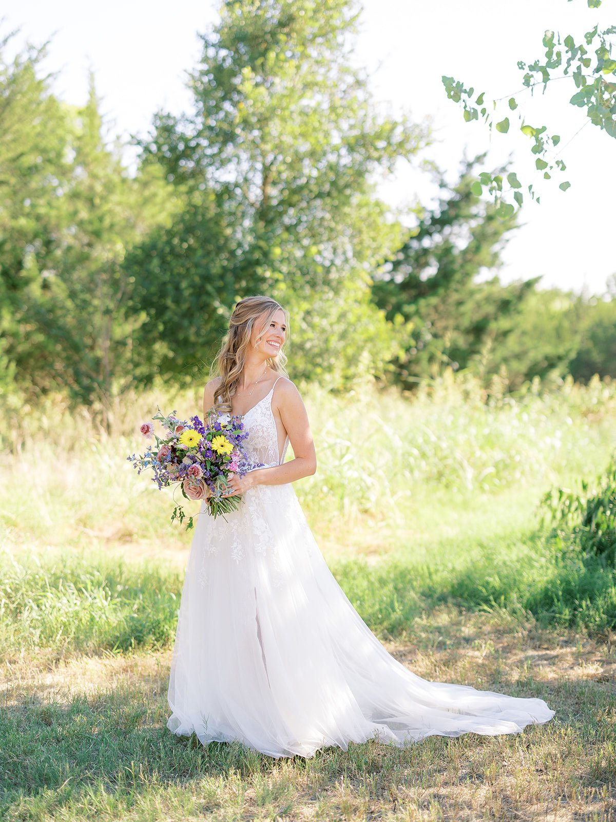 Bride holding a colorful wildflower bouquet