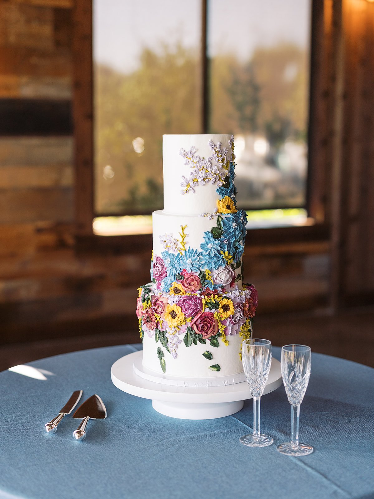 Colorful wildflower wedding cake designed by Ranch wedding planner Shannon Rose events