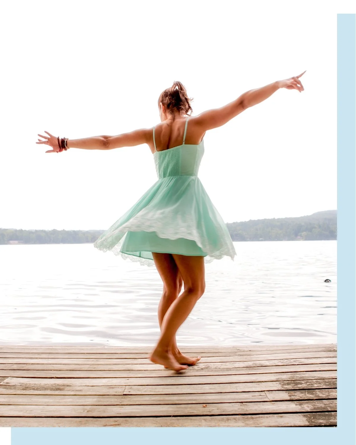 larissa carlson twirling on dock in teal dress