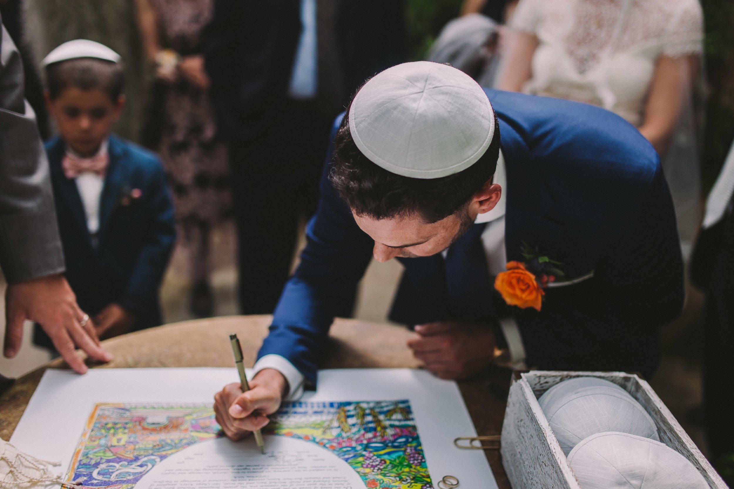 Groom Signing the Ketubah at Shelldance Orchid Gardens Pacifica