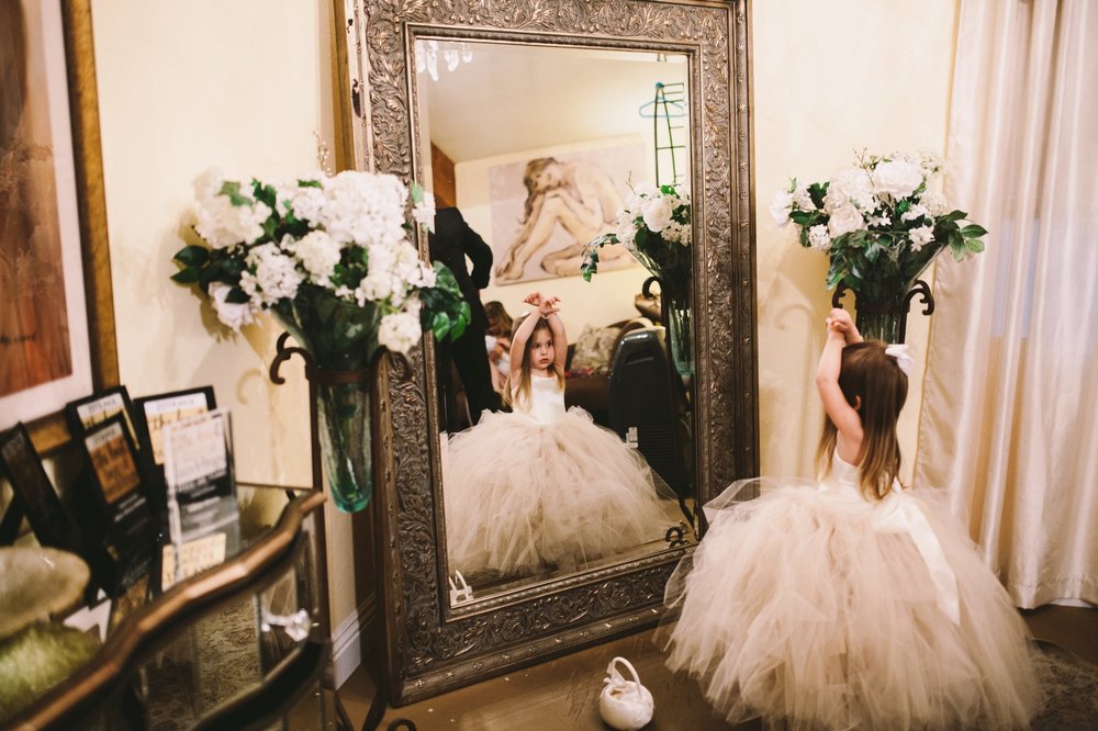 Flower Girl Looking in Mirror Wedding Photography