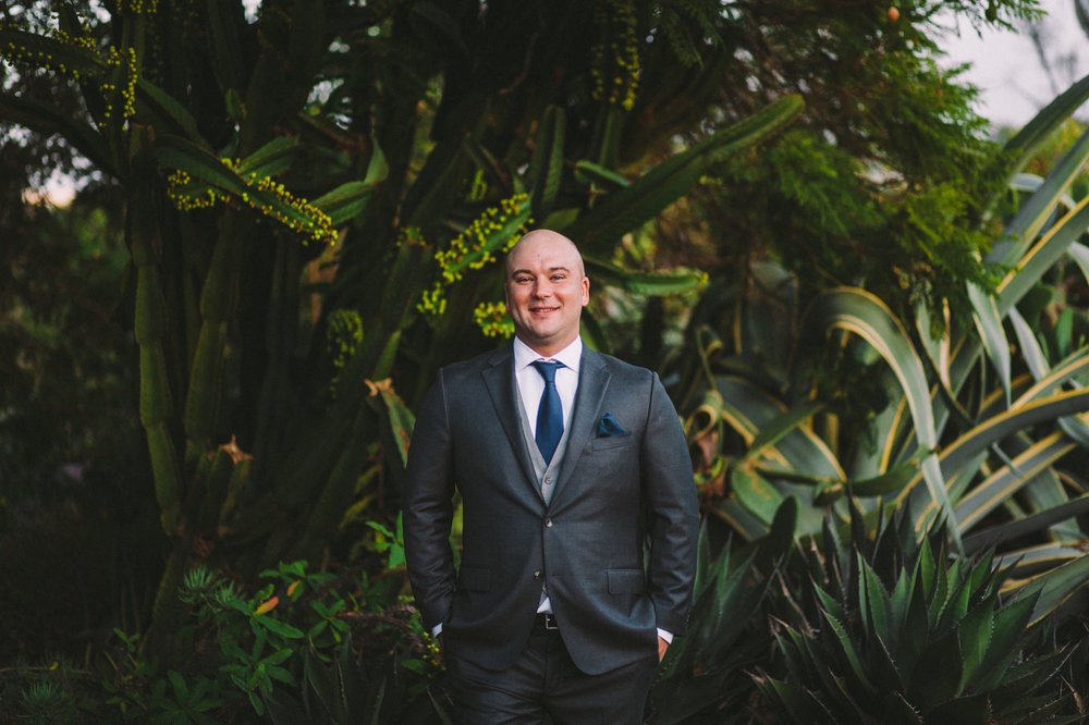 Groom Wearing Hickey Freeman Navy Suit