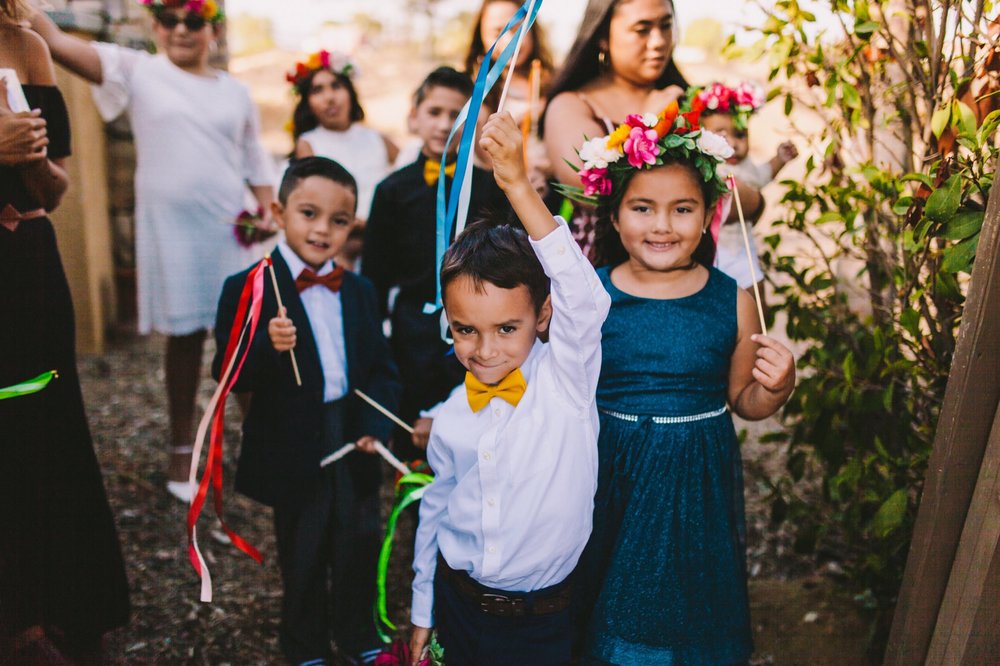 Flower Girls &amp; Boys with Colorful Ribbon Wands and Vibrant Flowers Crowns