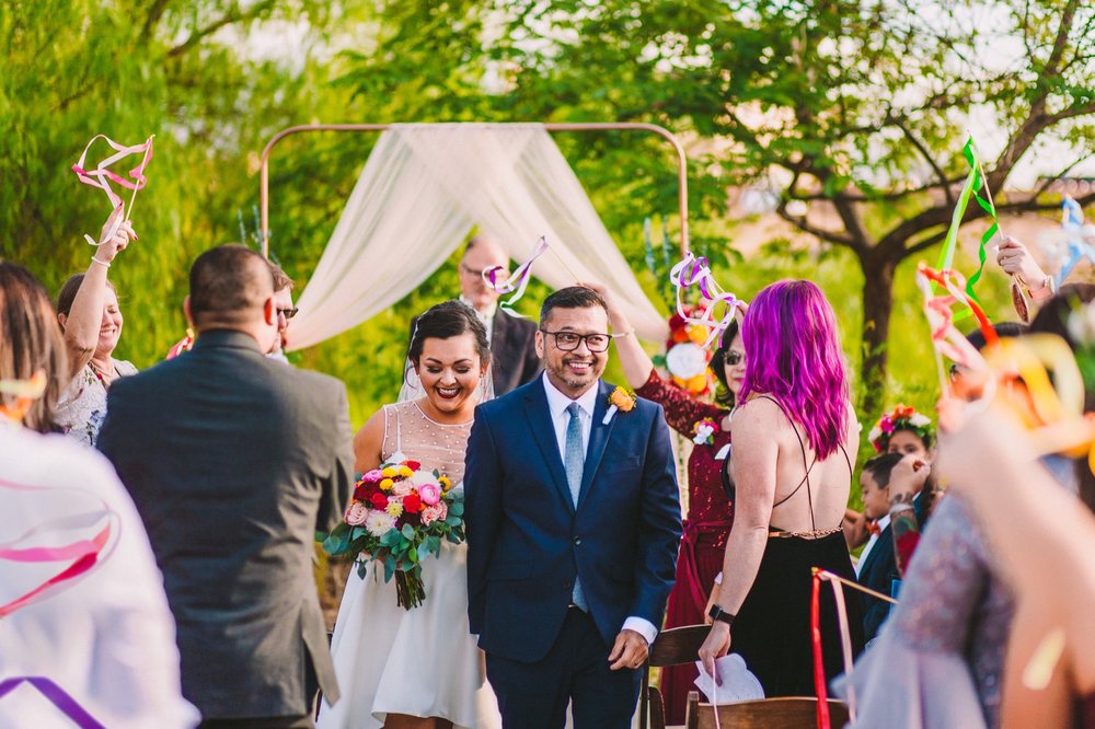 Joyful Wedding Ceremony Exit with Colorful Ribbon Wands