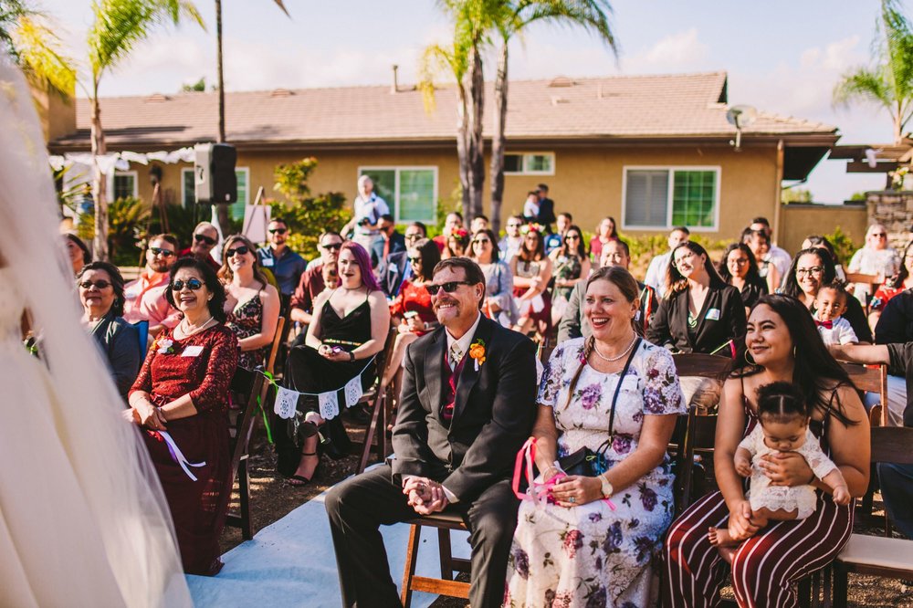 Guests Laughing During Wedding Ceremony - Documentary Wedding Photography Temecula