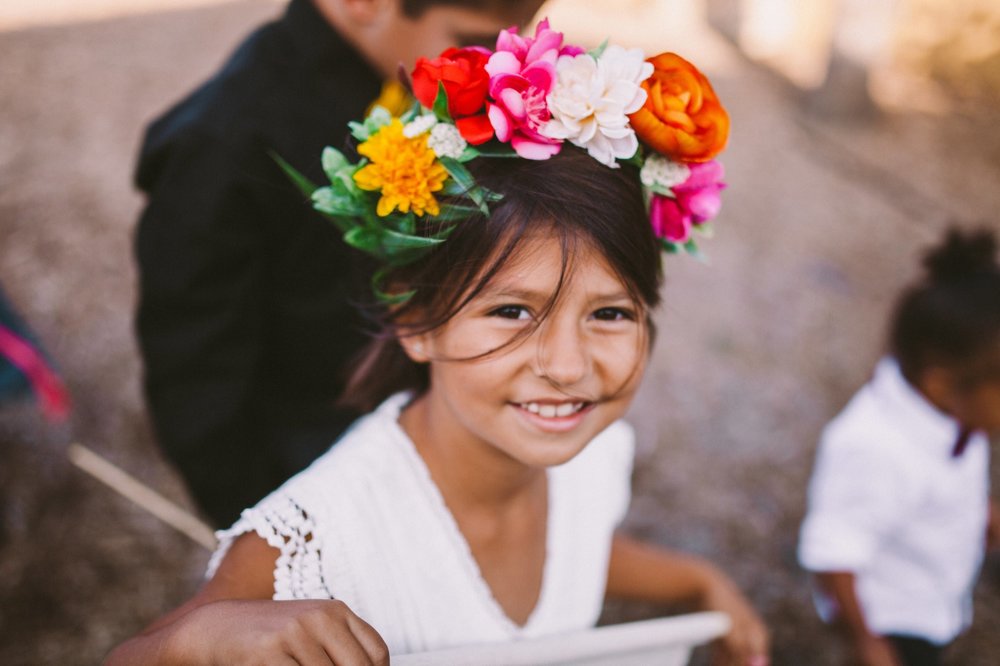 Flower Girl with Vibrant, Colorful Flower Crown for Wedding
