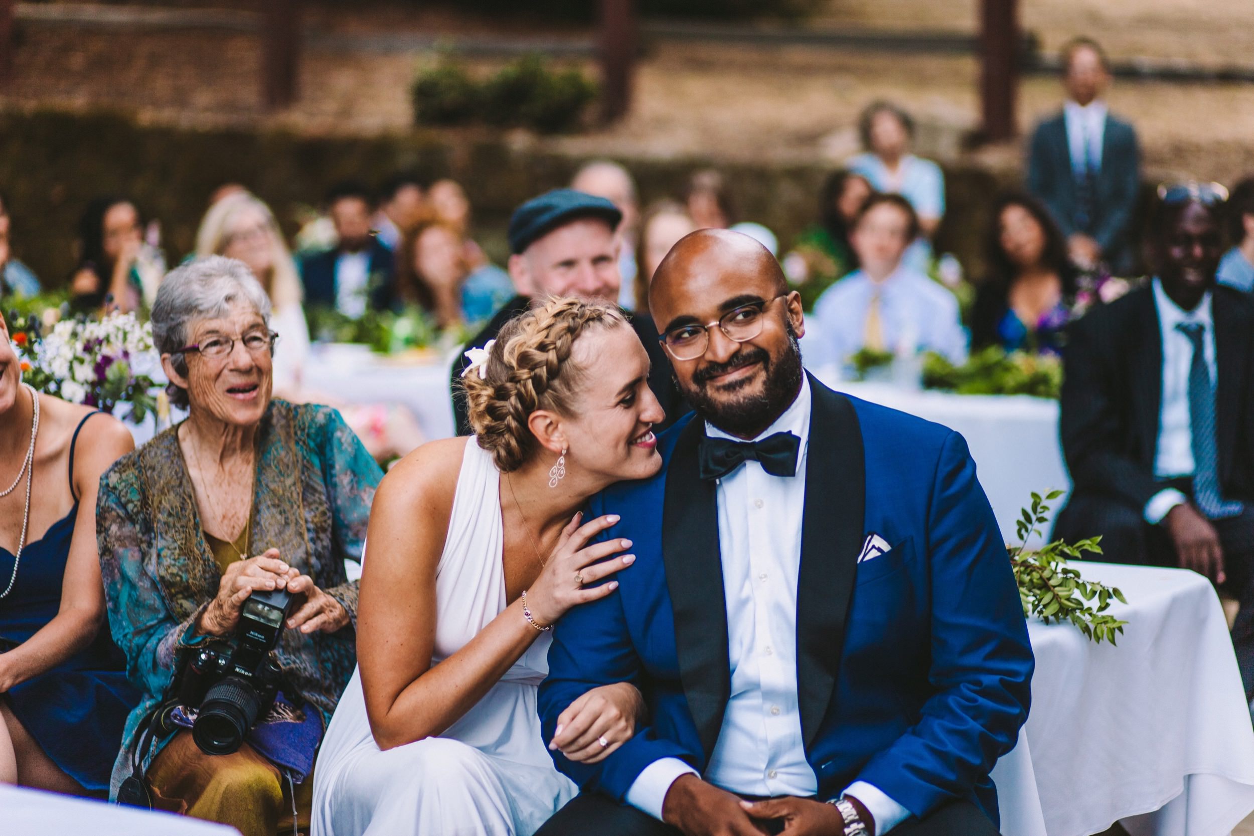 Bride &amp; Groom Sharing a Moment During Wedding Speeches