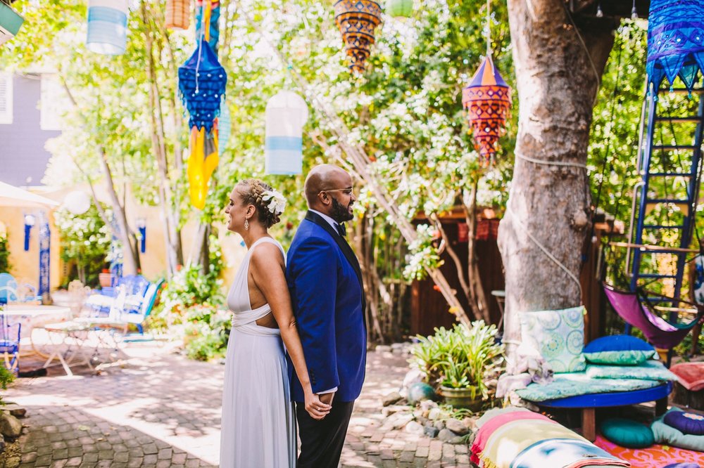 Colorful Photo of Bride &amp; Groom Back to Back Before First Look