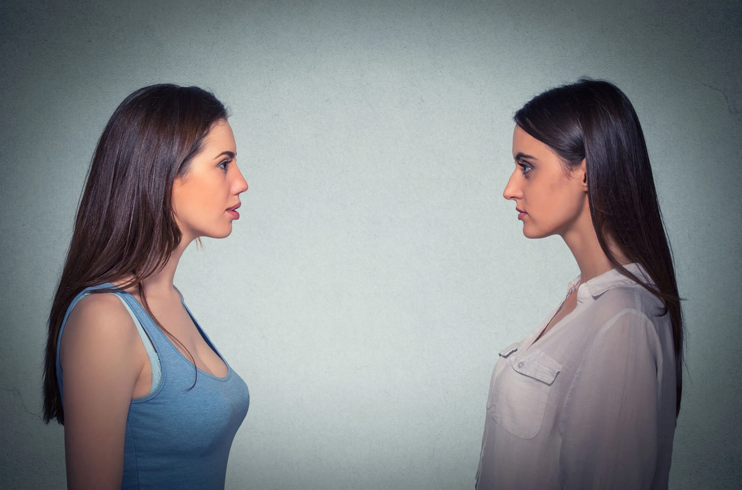 Two young woman observing themself.jpeg