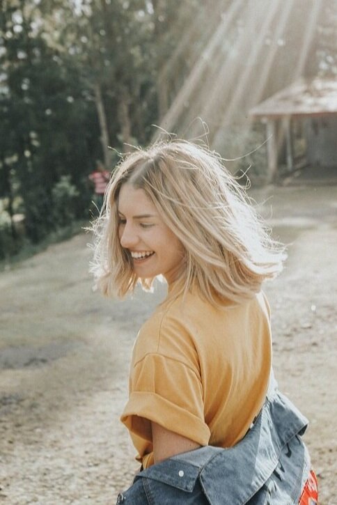 gian-cescon-00ByEXKcSkA-unsplash  happy young woman connected with spirit.jpg