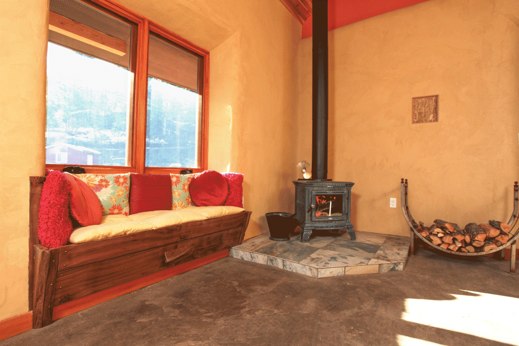  Earth floors with clay plastered interior walls provide distributed thermal mass for passive solar heating. 