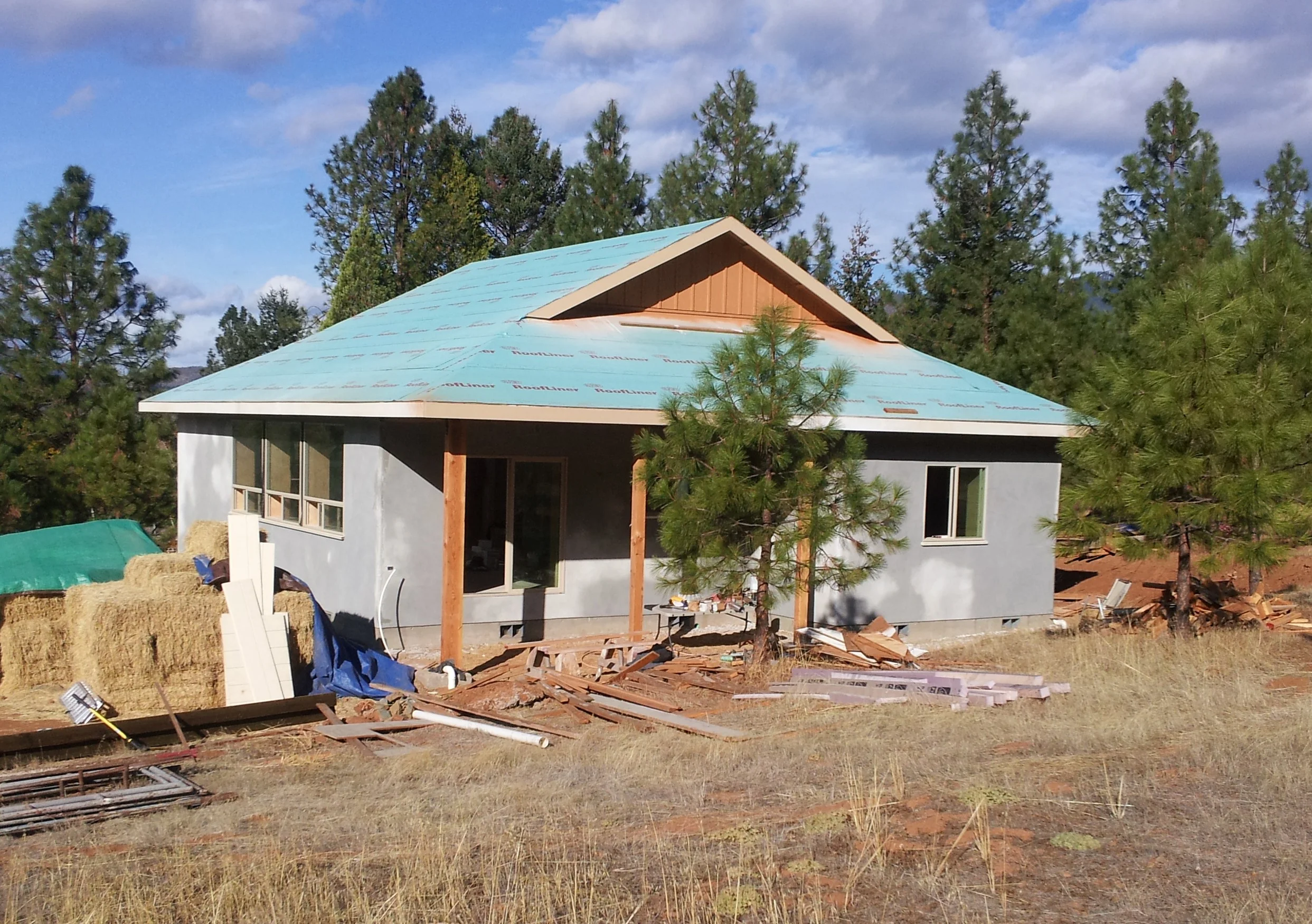 Lime plastered exterior of passive solar straw bale home.