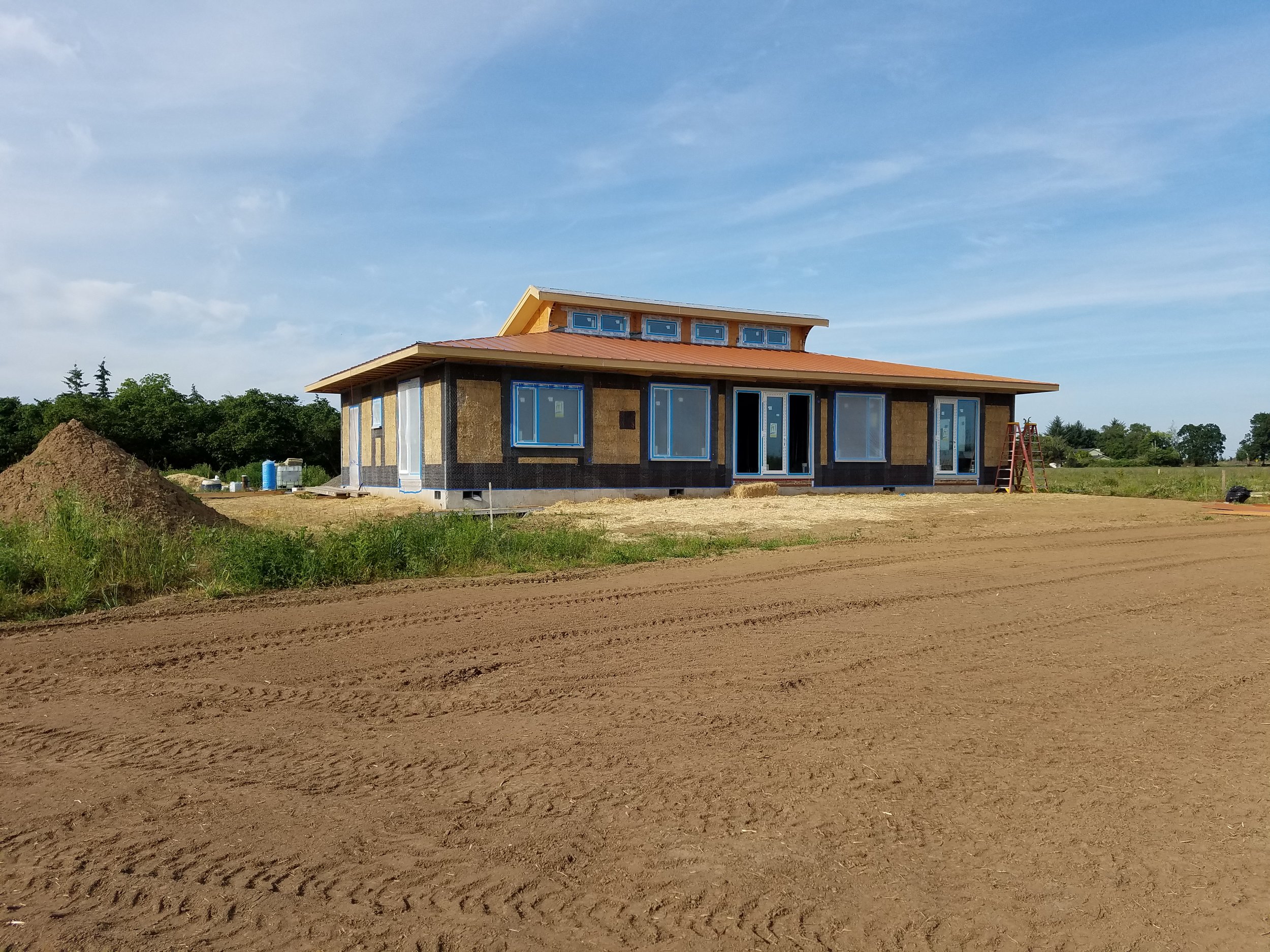  Passive solar straw bale home uses straw bale shear wall and interior partition shear walls. &nbsp;Lime exterior and interior plasters. 