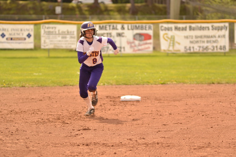 Katelyn Rossback runs to third after a hit from Sarah Allison. 