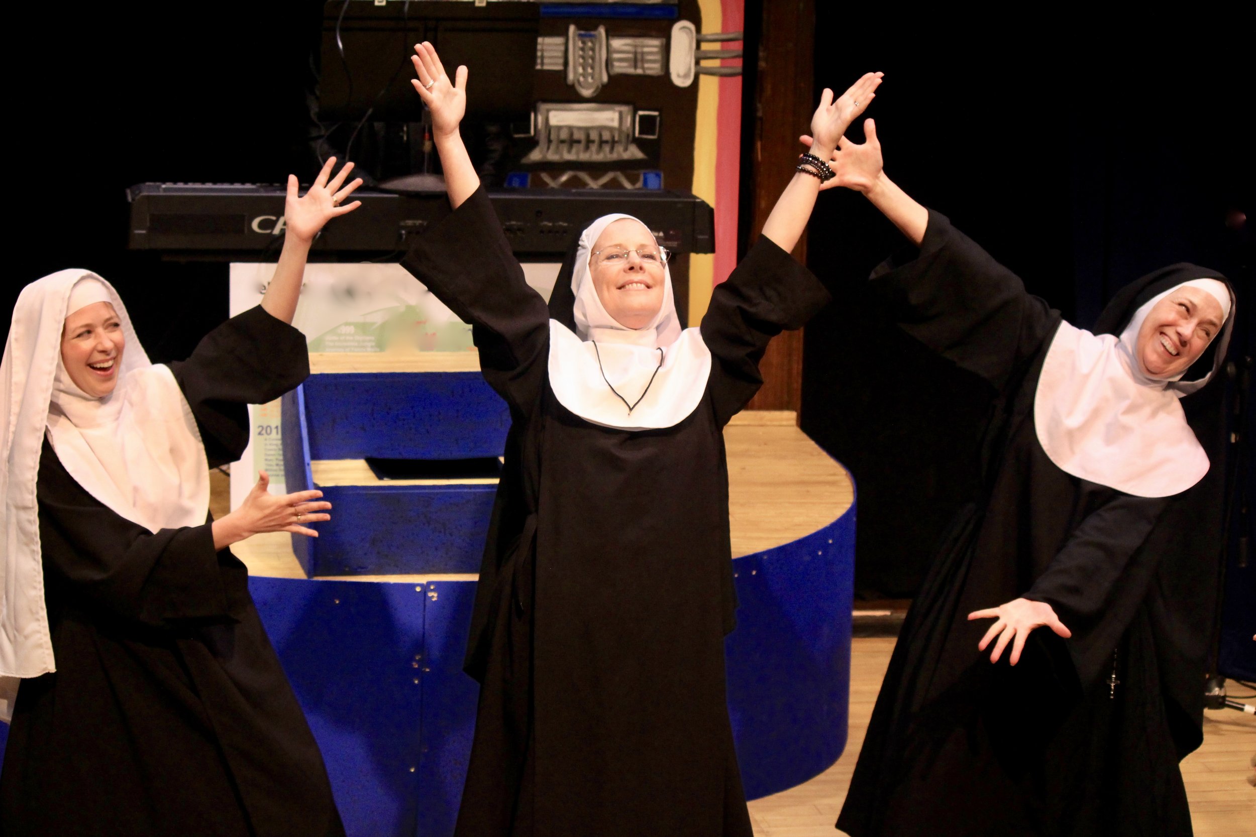 Nuns arms up trio.jpeg
