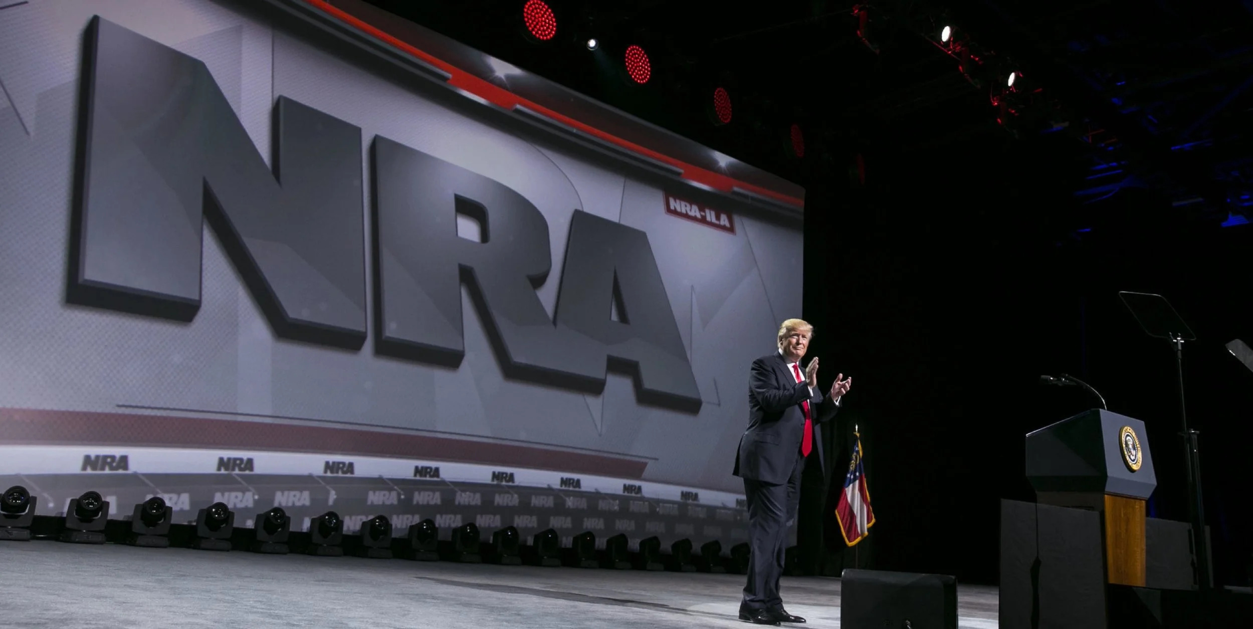 Trump On Stage With Guns Confiscated By Obama