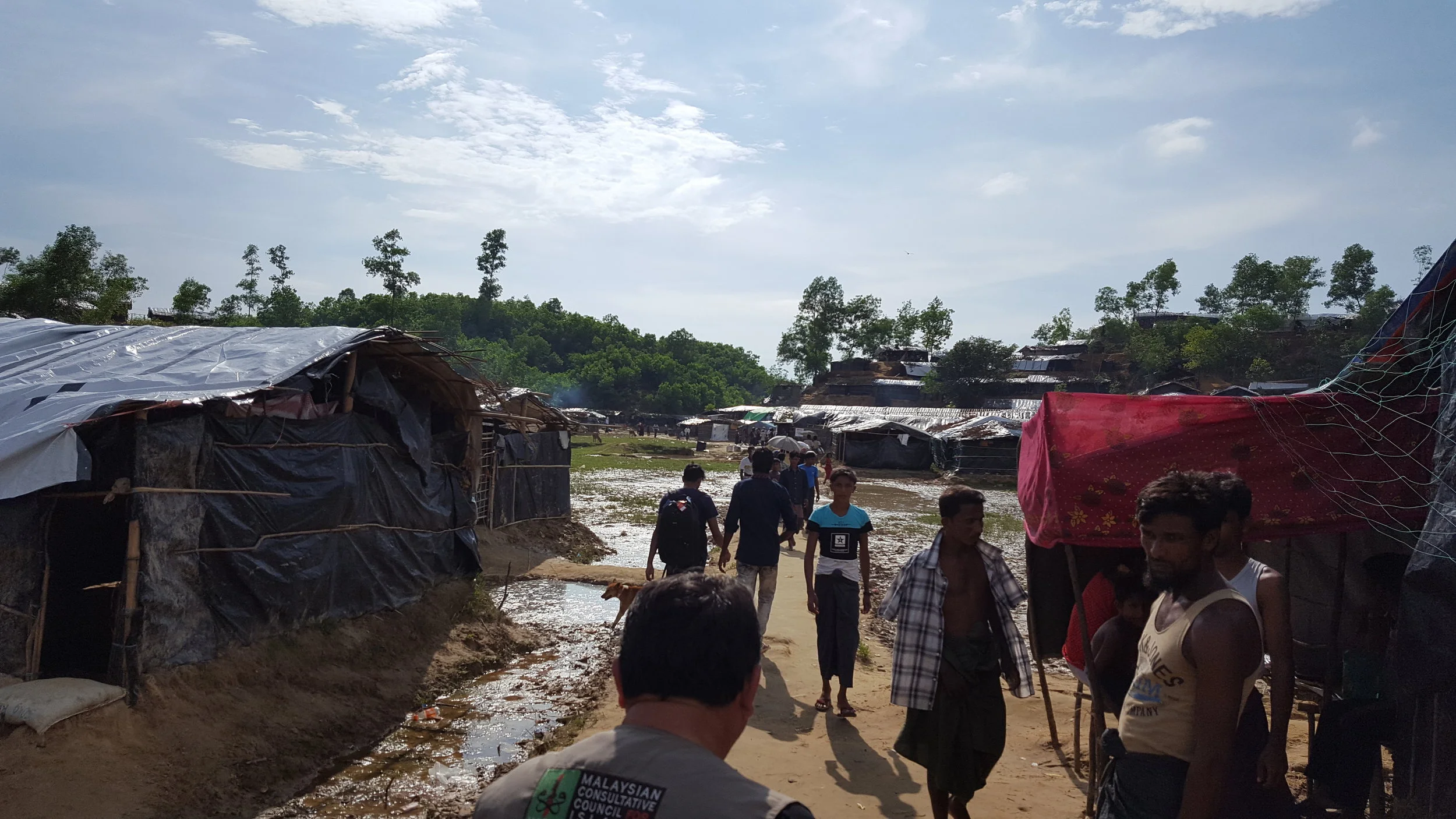 The living conditions in most refugee camps are unsanitary. Because there are few toilets, people relieve themselves wherever they can locate privacy. As a result, when it rains, water and feces flood the camps. Many of the children who are exposed to these unhygienic conditions are naked and barefoot. While international development organizations like Building Resources Across Communities (BRAC) have been building toilets (though few in the West would recognize them as such), these facilities are shared between literally thousands of people.