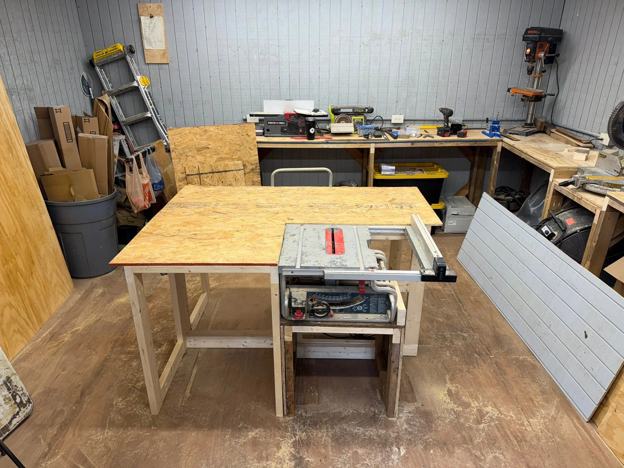 Table saw island ready for its final top.  Now that I have this surface and my tablesaw, I can begin working on all the cabinetry.  Above the bench and below.