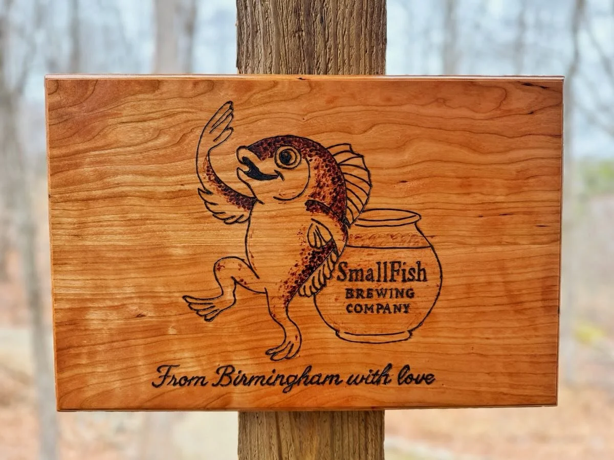 The original version of this sign had an &ldquo;internal structural deficiency&rdquo; causing it to crack and break in half.  I stand by my work and instantly set out to remake the sign.  I chose a different piece of cherry and reburned the design.  