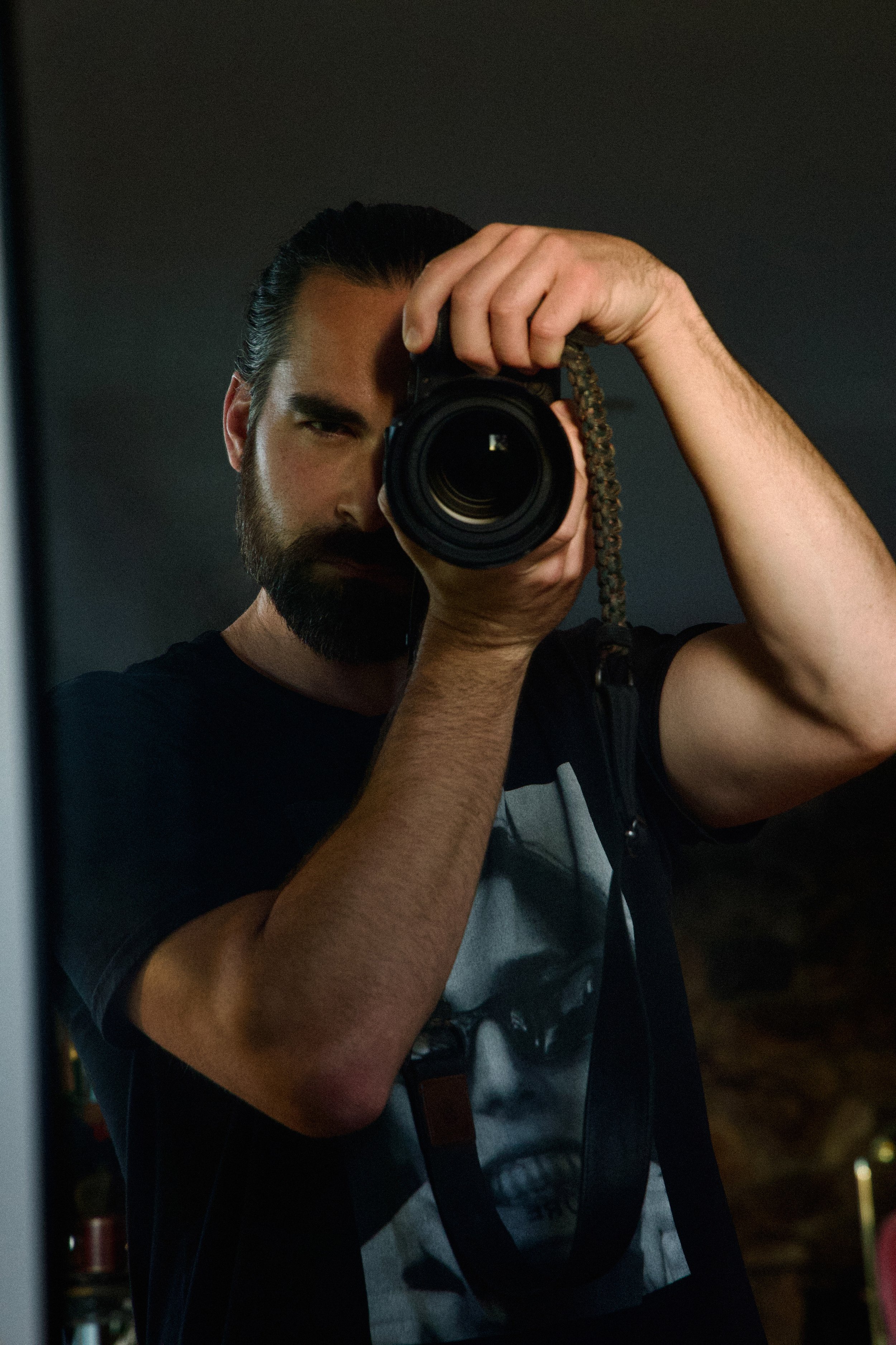 image of chris wood holding a camera to his eye Los Angeles photographer