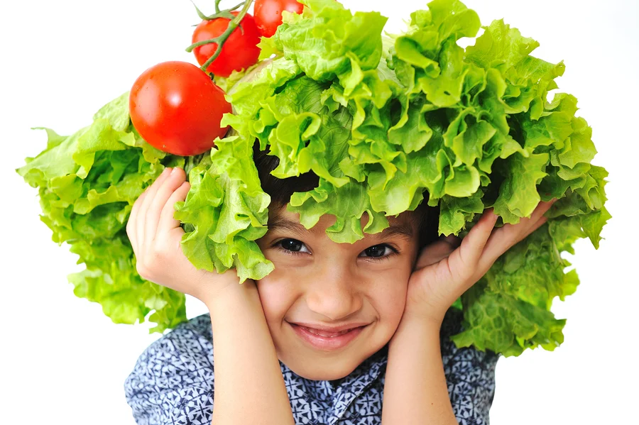 bigstock-Kid-with-salad-and-tomato-hat--15442769 (2).jpg
