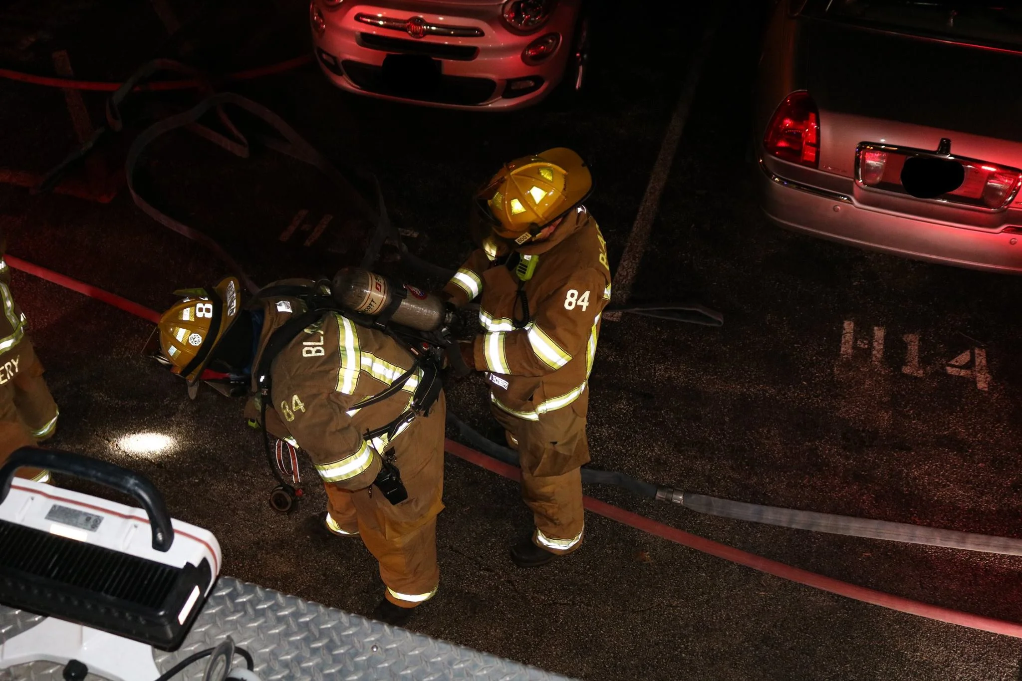 Firefighter McCann changes Firefighter Dunlap’s SCBA Cylinder.