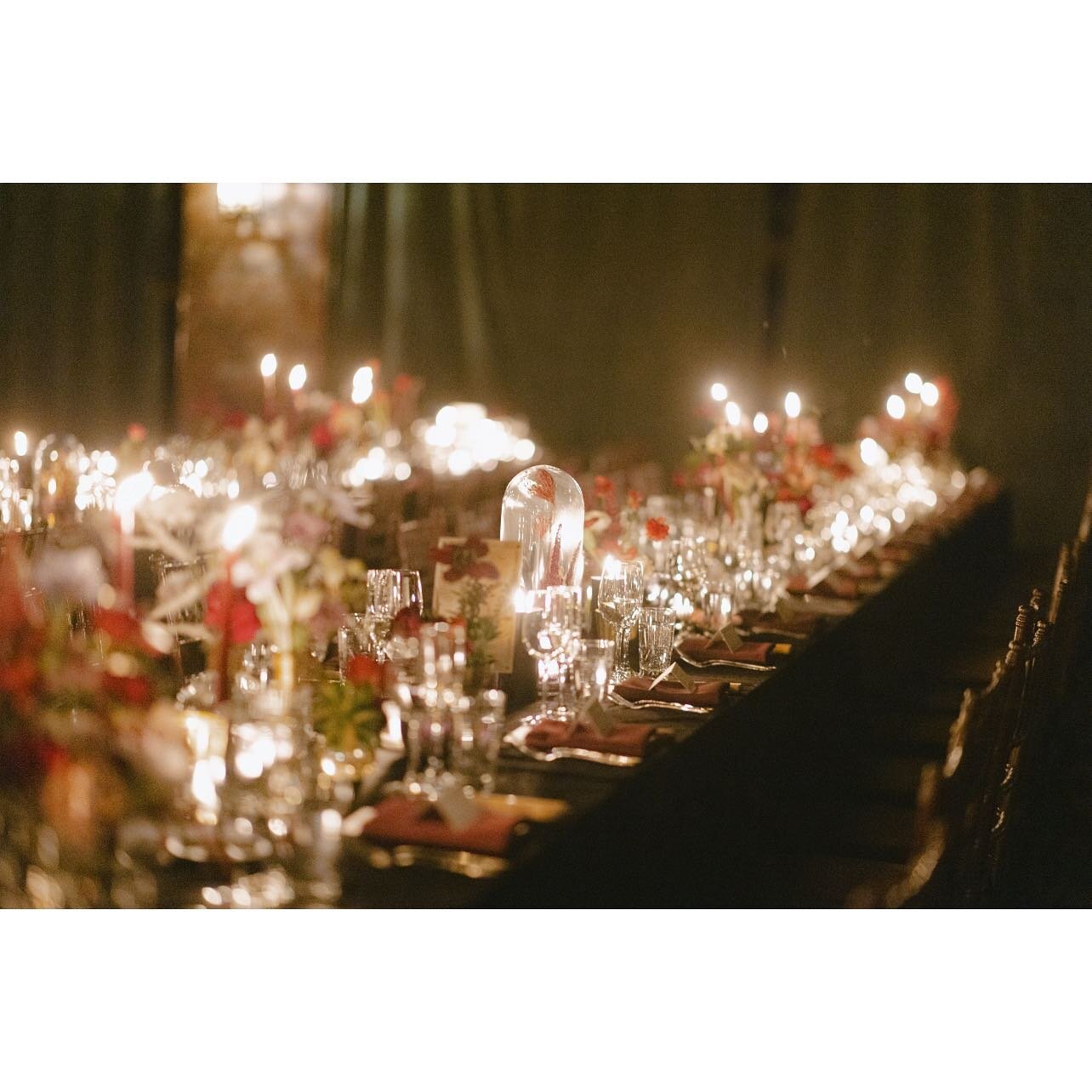 A continuation of E+J&rsquo;s wedding with this reception space! Burgundy taper candles in black holders, black pillar candles and lots of tea lights gave off a nice glow on the dried flower cloches and gold accents. 10/10 would do again! 
Photograph
