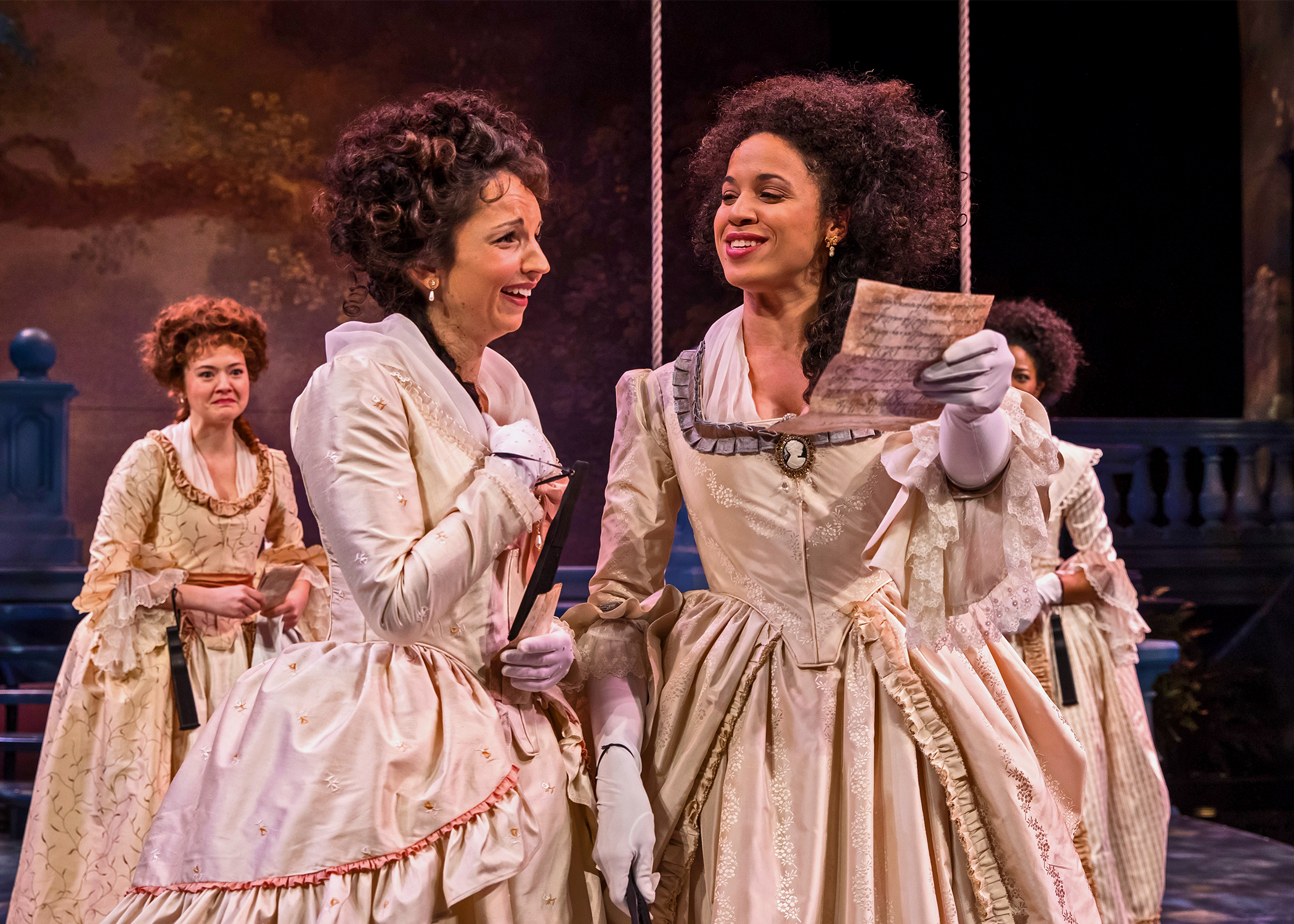 The Princess (Jennie Greenberry, at right) and Rosaline (Laura Rook) gleefully read through a love letter mistakenly delivered into the wrong hands, as Katherine (Taylor Blim) and Maria (Jennifer Latimore) look on in Chicago Shakespeare Theater’s productions of Love’s Labor's Lost , directed by Marti Maraden, February 7th – March 26, 2017. Photo by Liz Lauren.
