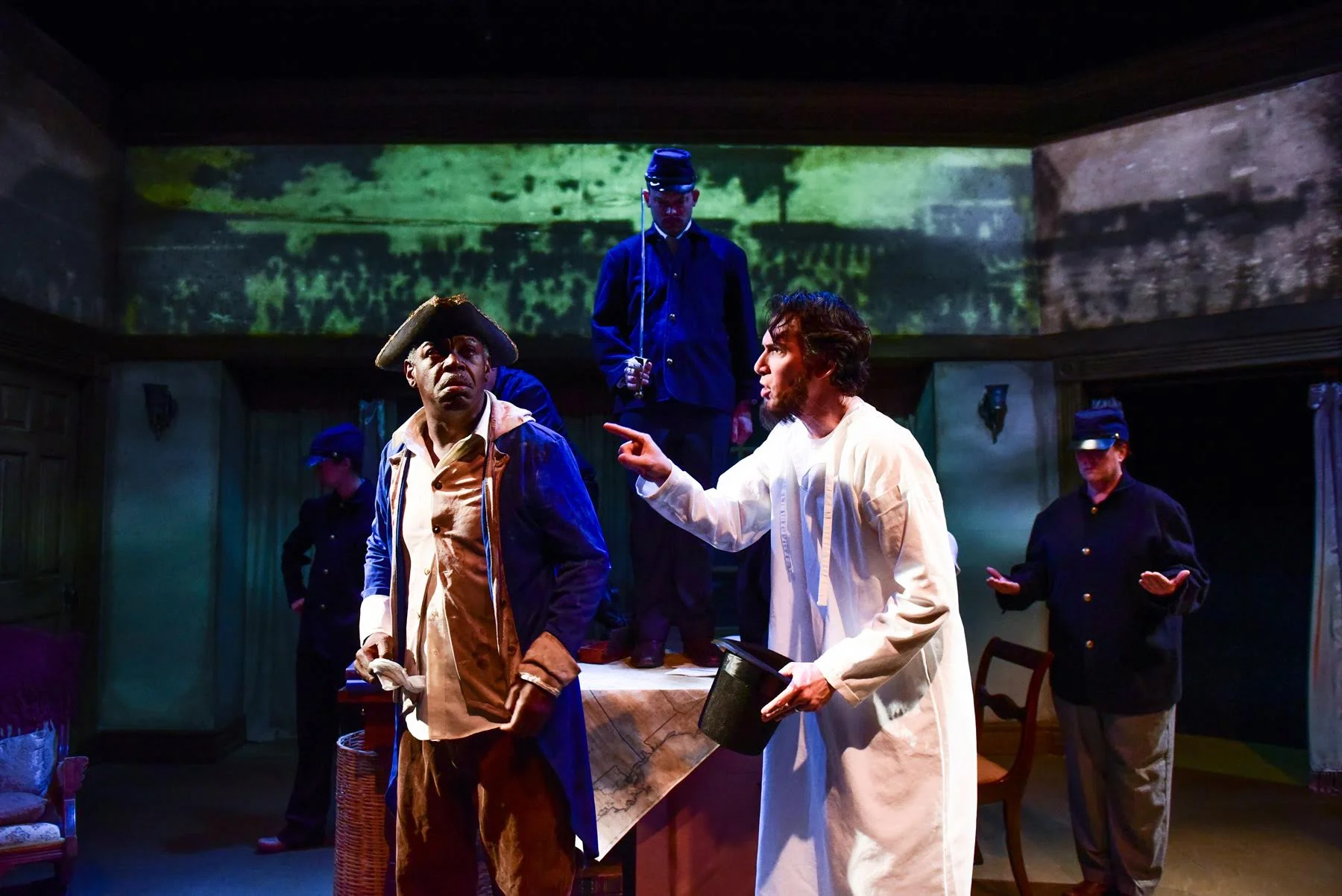 Darren Jones and Lawrence Grimm with the cast of Shattered Globe Theatre’s in THE HEAVENS ARE HUNG IN BLACK. Photo by Evan Hanover.