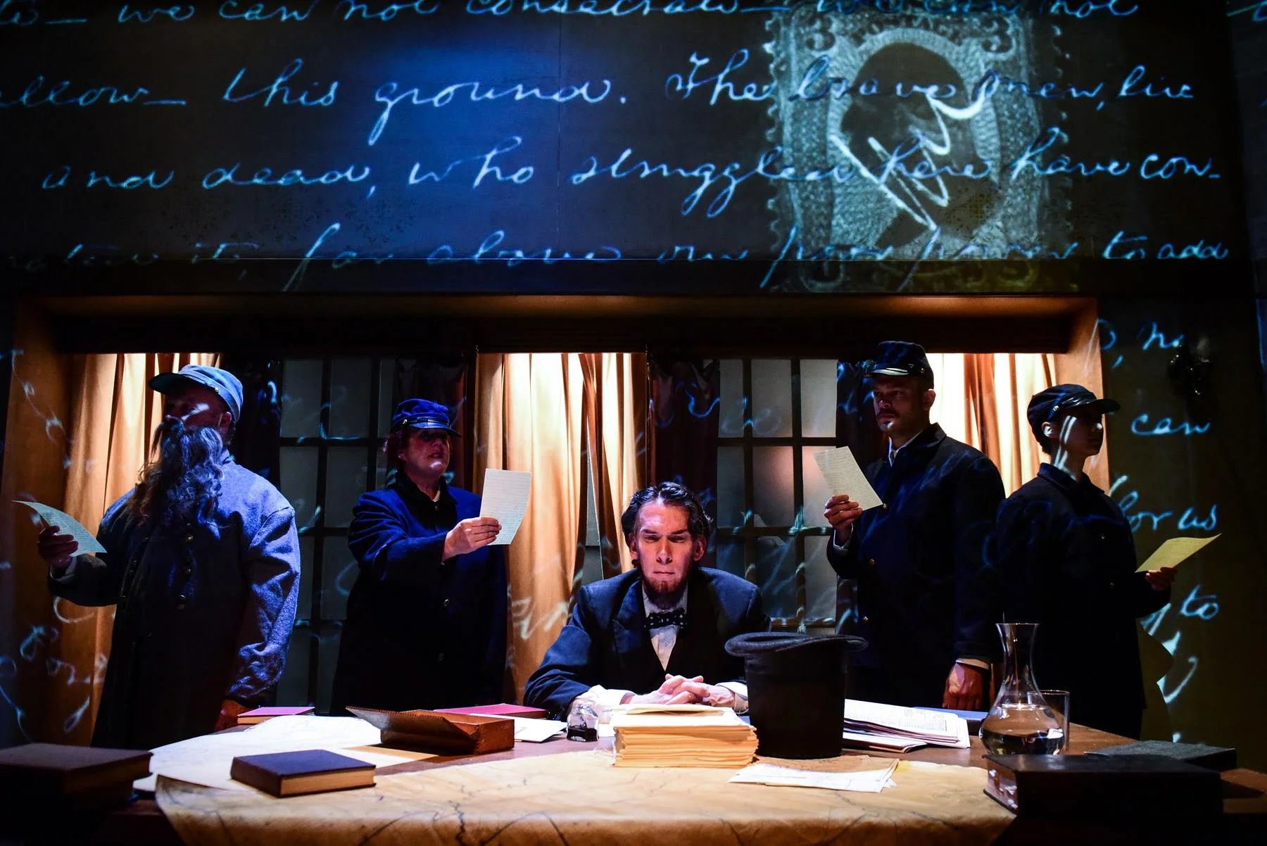 Lawrence Grimm and the cast of Shattered Globe Theatre in THE HEAVENS ARE HUNG IN BLACK by James Still, directed by Louis Contey. Photo by Evan Hanover.