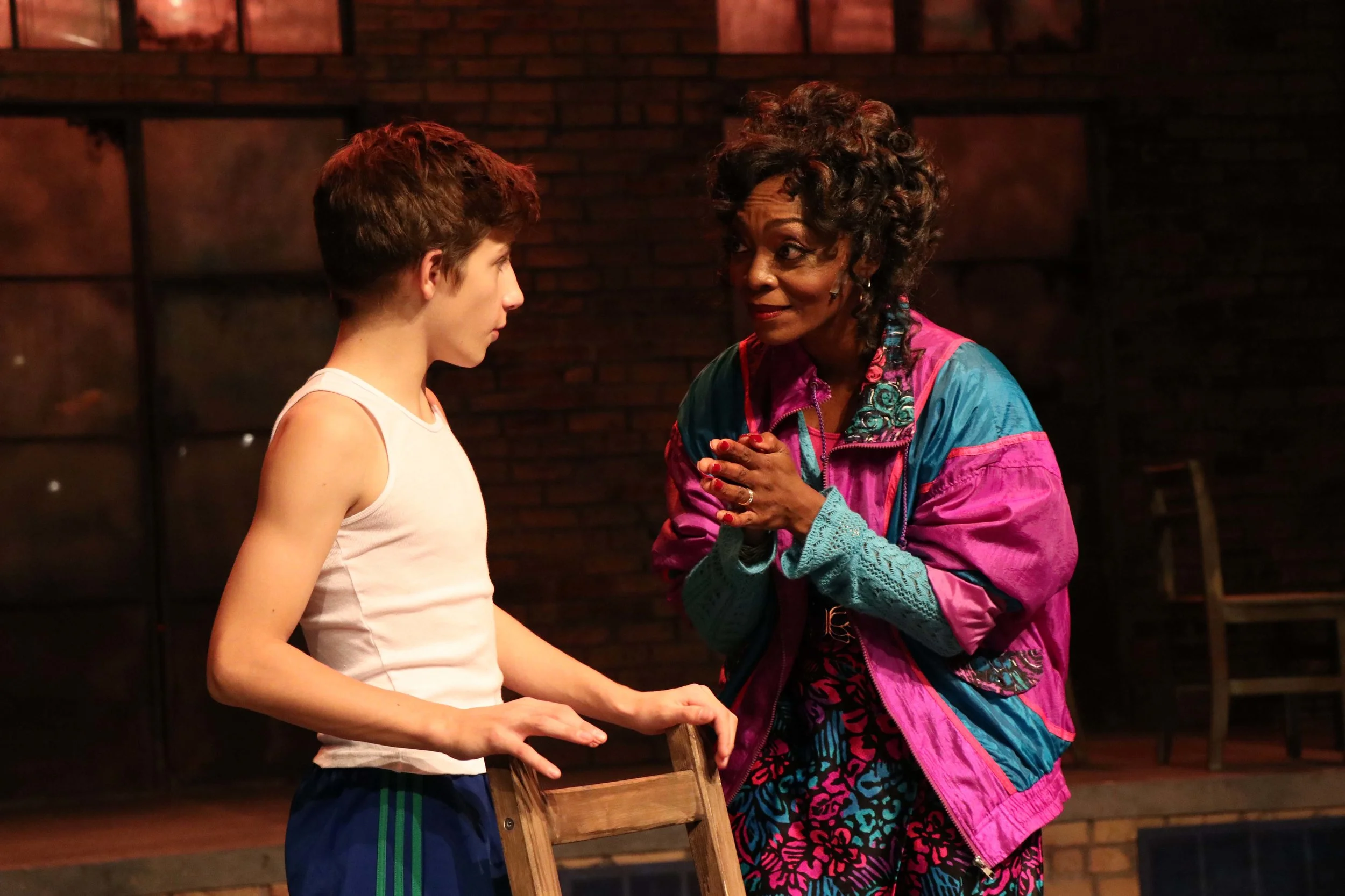  Lincoln Seymour as "Billy Elliot" and Shanésia Davis as "Mrs. Wilkinson" in Porchlight Music Theatre's "Billy Elliot the Musical." Photo by Austin Packard