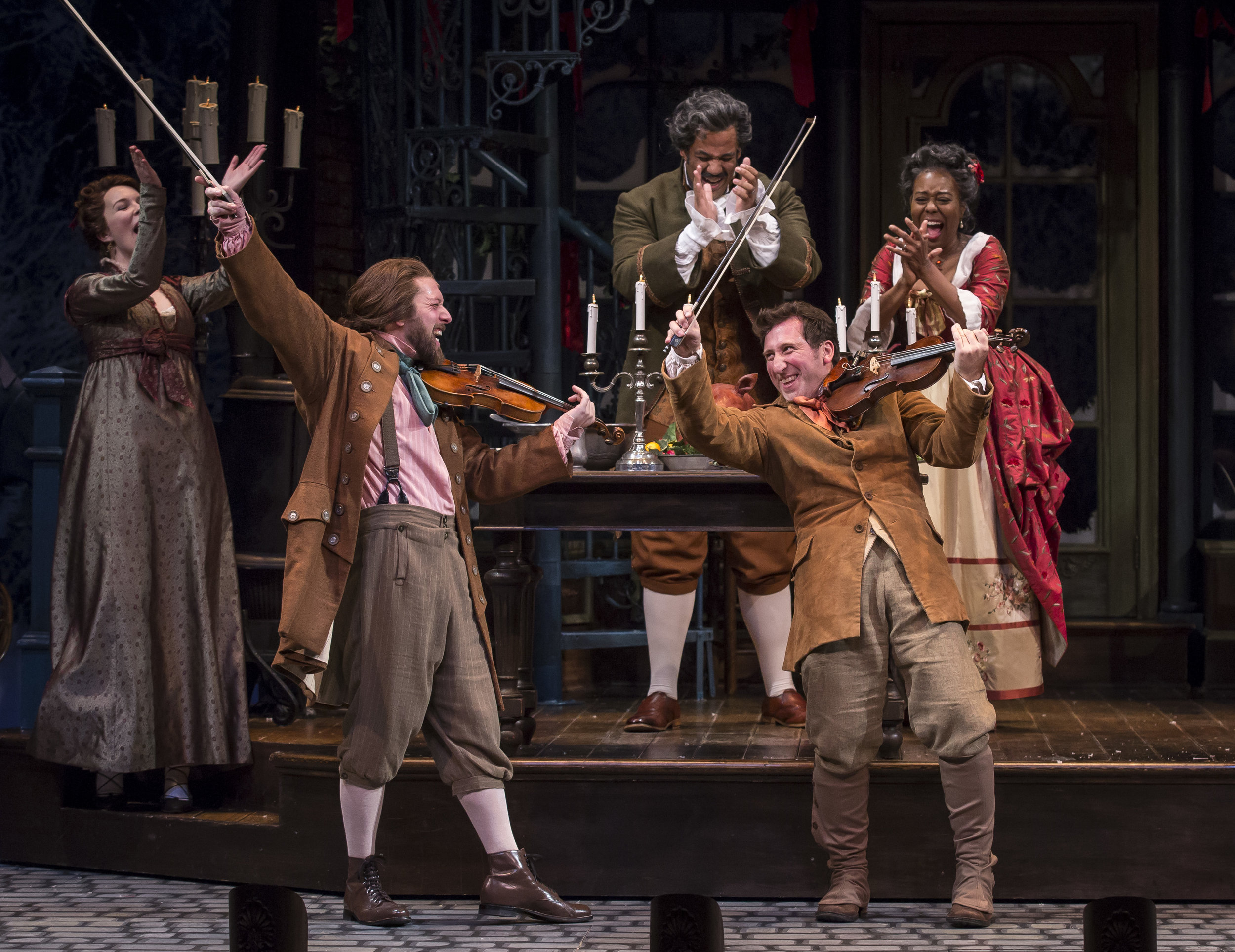 Ali Burch, Andrew Coil (Musician/Fiddler), Jonah D. Winston (Mr. Fezziwig), Penelope Walker (Mrs.Fezziwig) and Gregory Hirte (Musician, Fiddler) in the 40th annual production of A Christmas Carol , directed by Henry Wishcamper at Goodman Theatre.